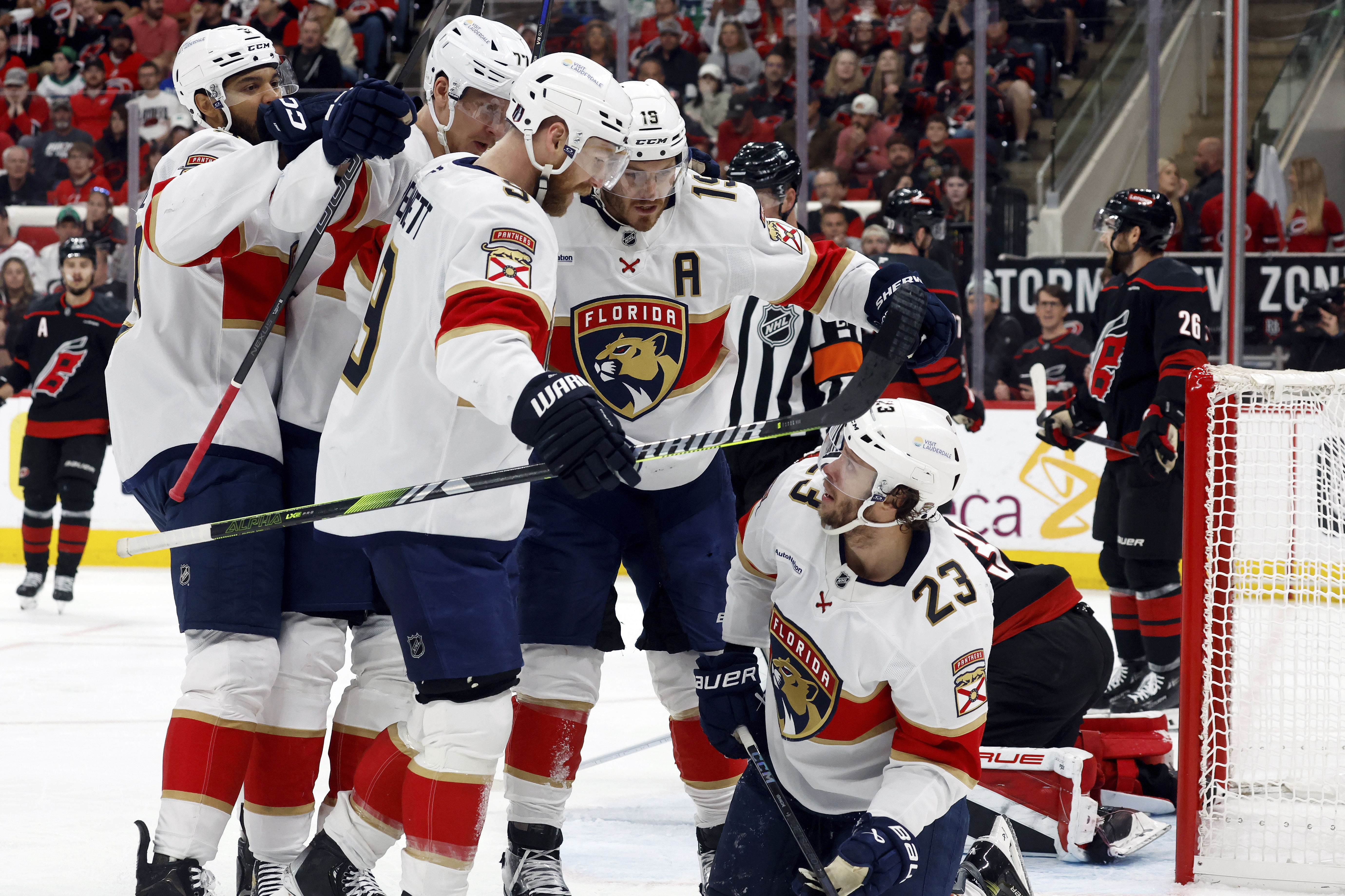 Florida Panthers players celebrate a goal by Matthew Tkachuk (19) during the first period of Game 2 of the NHL hockey Stanley Cup Eastern Conference finals against the Carolina Hurricanes in Raleigh, N.C., Thursday, May 22, 2025.