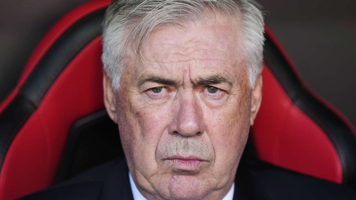 Real Madrid's head coach Carlo Ancelotti waits for the start of a Spanish La Liga soccer match between Sevilla and Real Madrid at the Ramon Sanchez Pizjuan stadium in Seville, Spain, Sunday, May 18, 2025.