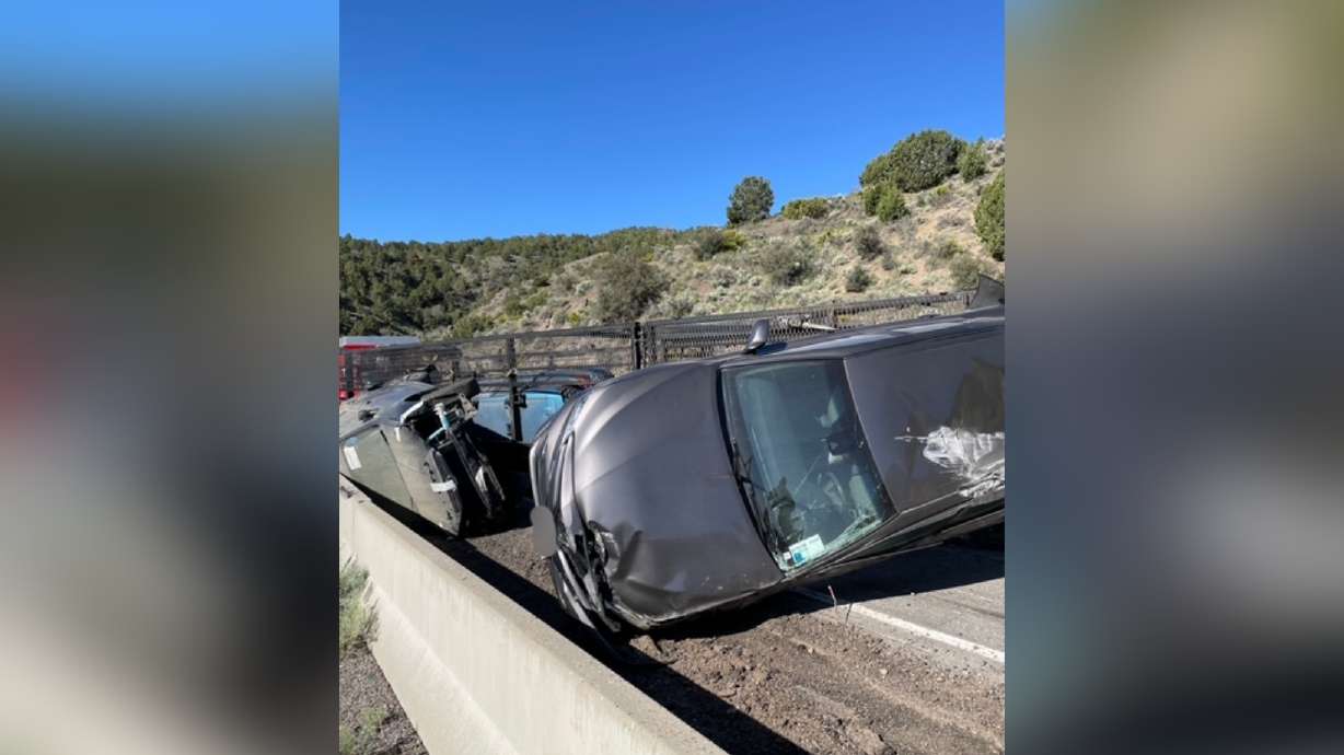 Wreckage after a trailer carrying cars rolled on U.S. 6, blocking westbound lanes near Eureka, in Juab County, on Friday. U.S. 6 has now been reopened.