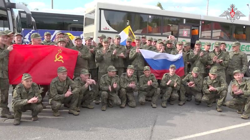 A still image shows what is said to be Russian service personnel captured by Ukrainian forces and released during the latest exchange of prisoners of war in the course of the Russia-Ukraine conflict, at an unknown location in Belarus, in this image taken from handout footage released Friday.