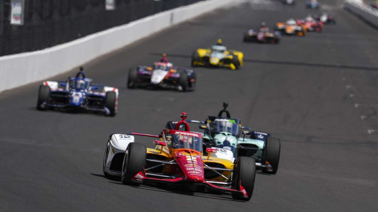 Josef Newgarden drives into the first turn during practice for the Indianapolis 500 auto race at Indianapolis Motor Speedway in Indianapolis, Friday, May 23, 2025.