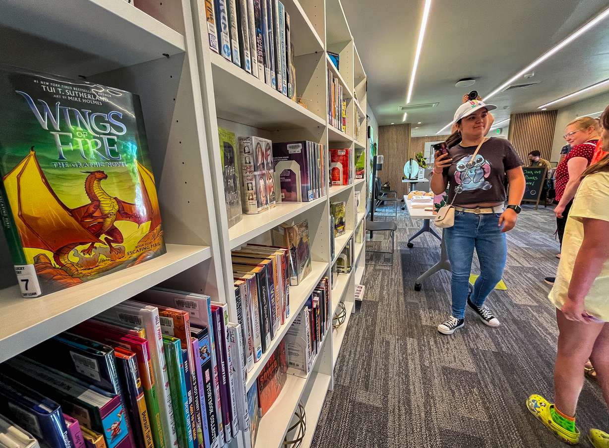 People explore the Ballpark Library Lab in Salt Lake City on Friday. It is the first of its kind for the city and Ballpark neighborhood, which is undergoing a major transformation since losing the Salt Lake Bees.