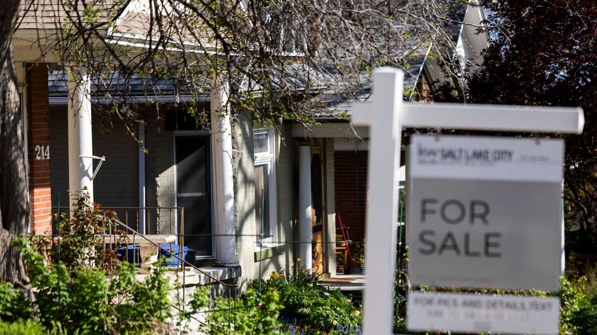 A for sale sign sits outside a home in Salt Lake City on April 22. One in seven pending home sales in the U.S. were canceled in April, the highest share of sales to fall through since 2020, according to a new analysis by Redfin.