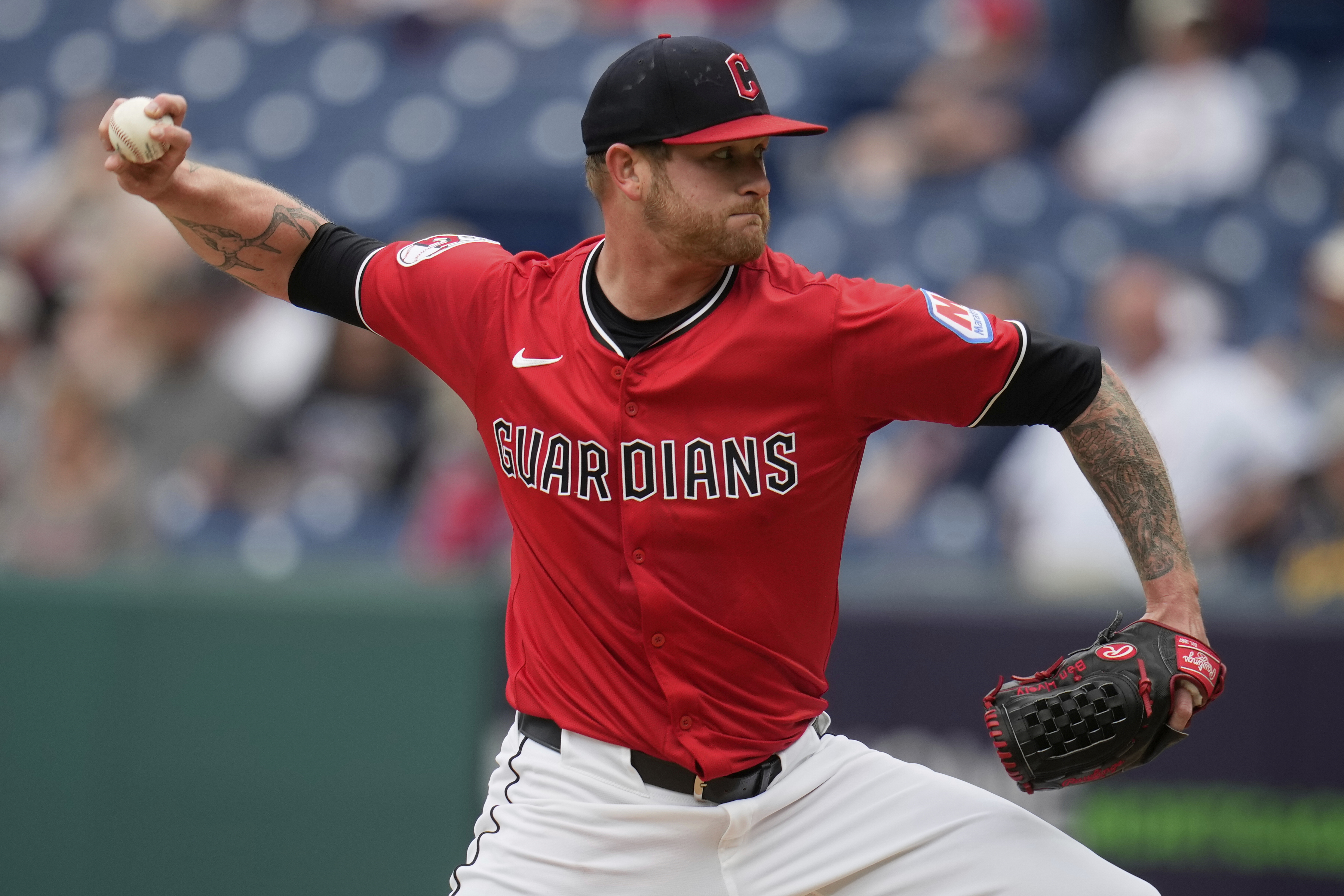 Cleveland Guardians' Ben Lively pitches in the first inning of a baseball game against the Milwaukee Brewers in Cleveland, Monday, May 12, 2025.