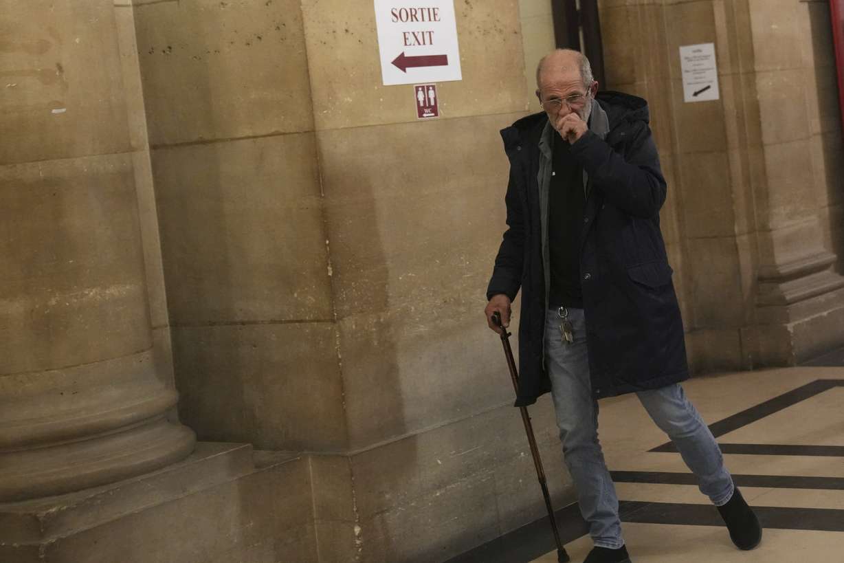 Defendant Aomar Aït Khedache, one of the men accused in the 2016 armed robbery of Kim Kardashian, leaves after the verdict in the trial of Kim Kadashian heist, Friday, in Paris.