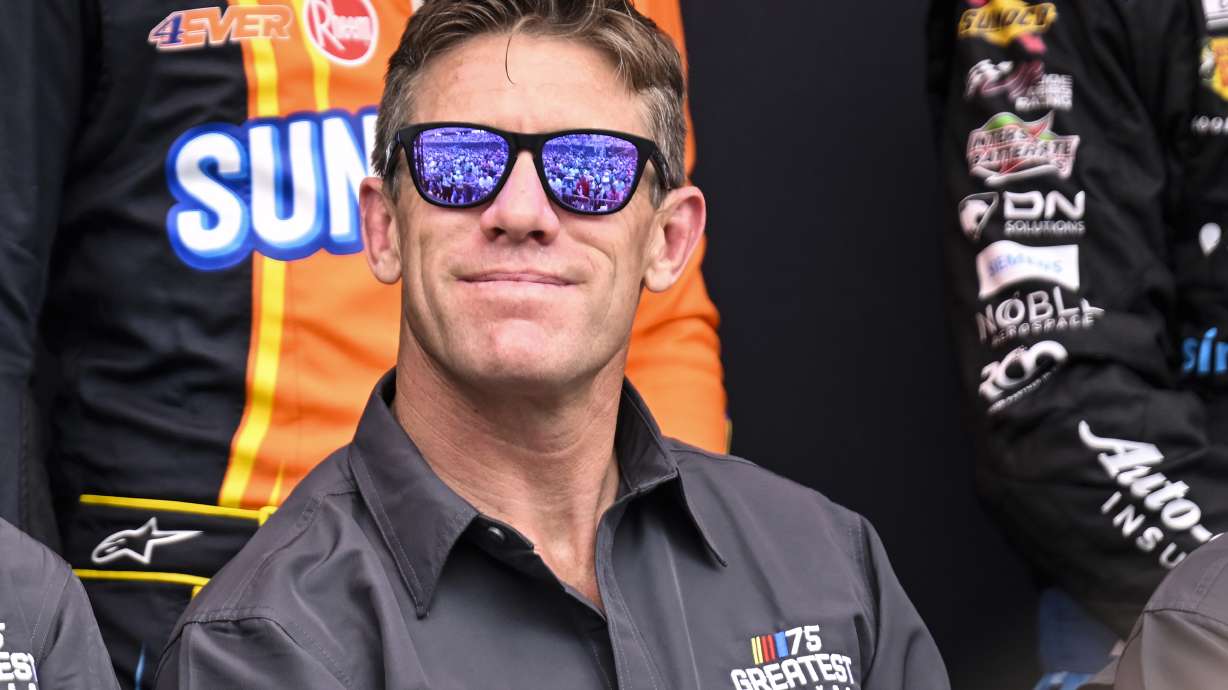 FILE - Carl Edwards smiles prior to a NASCAR Cup Series auto race at Darlington Raceway, Sunday, May 14, 2023, in Darlington, S.C.