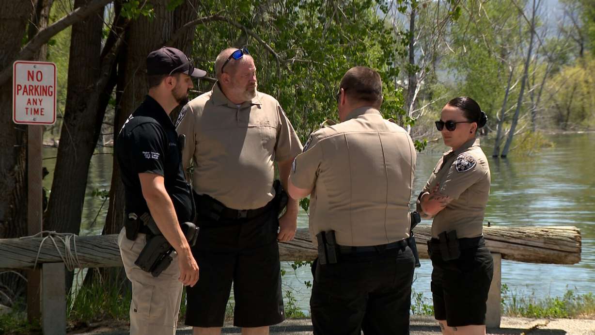 Deputy Alex Coleman (left) and Weber County deputies prepare to patrol the waters of Pineview Reservoir.
