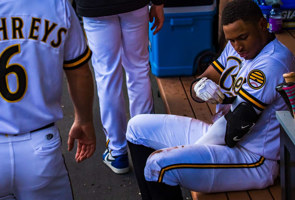 Salt Lake Bees infielder Christian Moore straps an elbow pad on before an at-bat during a game between the Bees and Omaha Storm Chasers at The Ballpark at America First Square in South Jordan on Thursday.