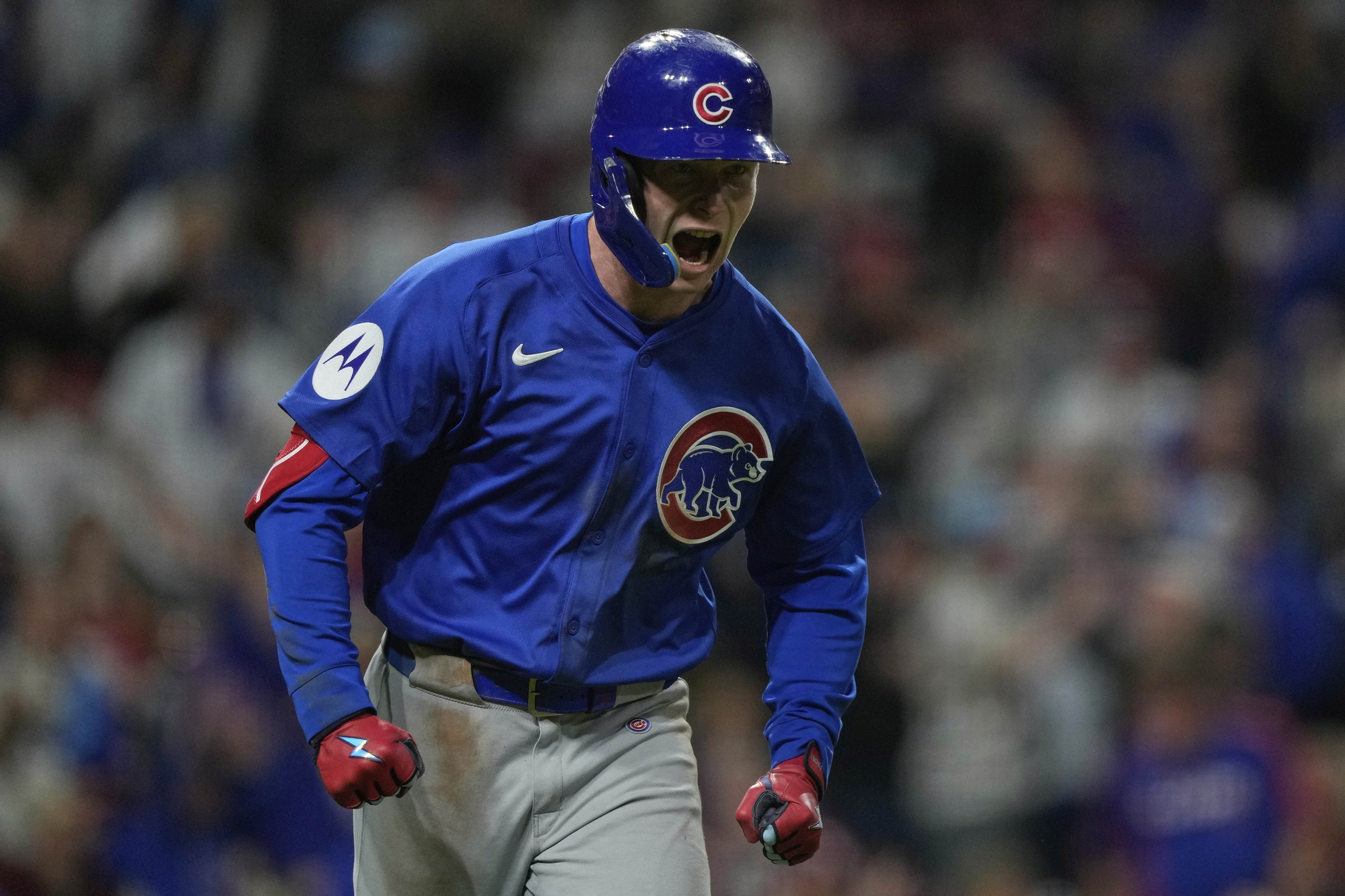 Chicago Cubs' Pete Crow-Armstrong reacts after hitting a grand slam to right field during the seventh inning of a baseball game against the Cincinnati Reds, Friday, May 23, 2025, in Cincinnati.