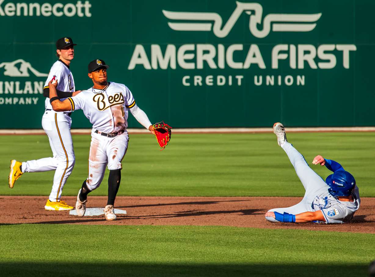 Salt Lake Bees infielder Christian Moore turns a double play during the Bees' matchup against Omaha on Thursday.
