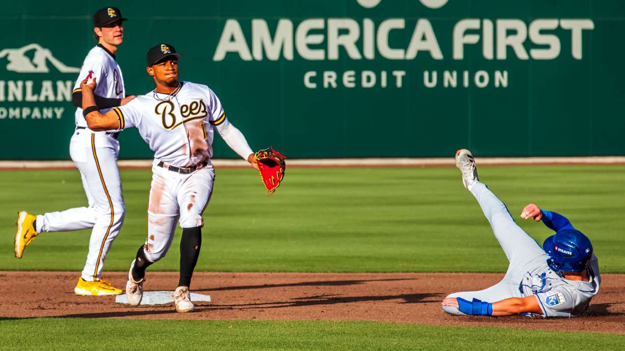 Salt Lake Bees infielder Christian Moore turns a double play during the Bees' matchup against Omaha on May 22, 2025.