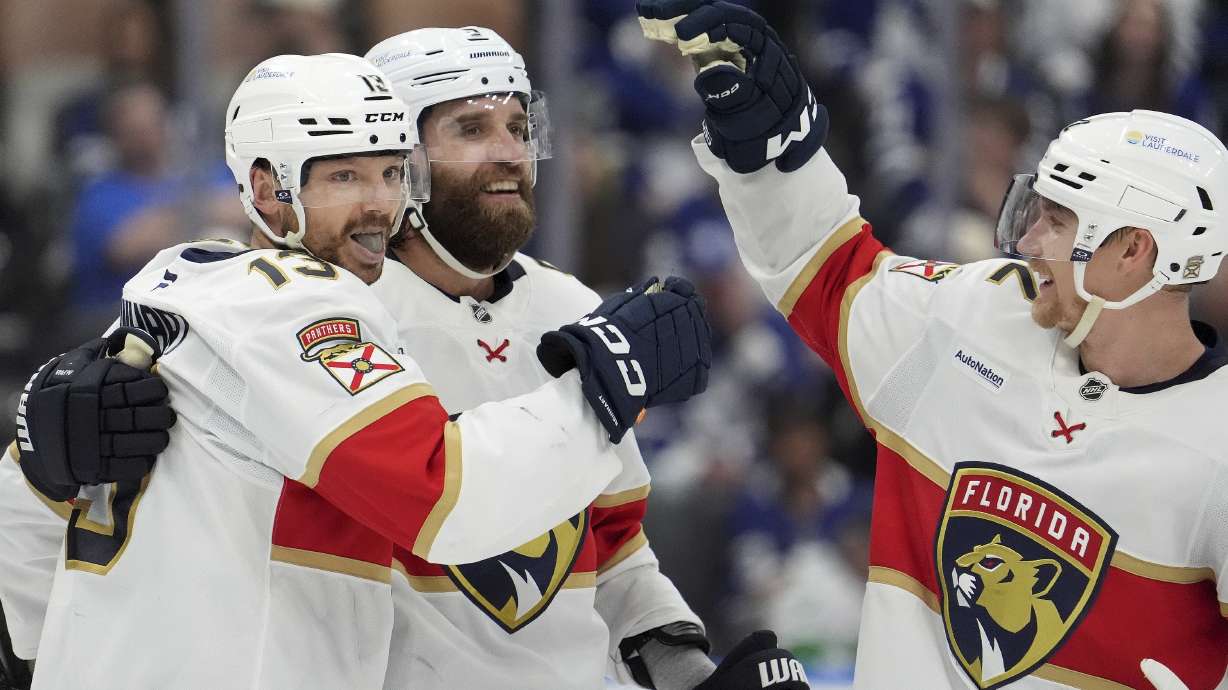 Florida Panthers centre Sam Reinhart (13) celebrates his goal with teammates Aaron Ekblad (5) and Gustav Forsling (42) during the third period of Game 7 of a second-round NHL hockey playoff series in Toronto, Sunday, May 18, 2025.