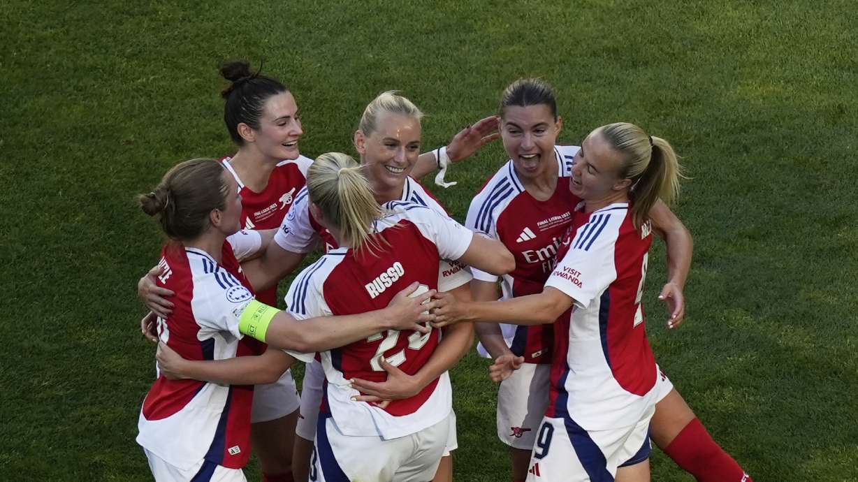 Arsenal's Stina Blackstenius, third from right, celebrates with her teammates after scoring her side's opening goal during the women's Champions League final soccer match between Arsenal and FC Barcelona at the Jose Alvalade Stadium in Lisbon, Saturday, May 24, 2025.