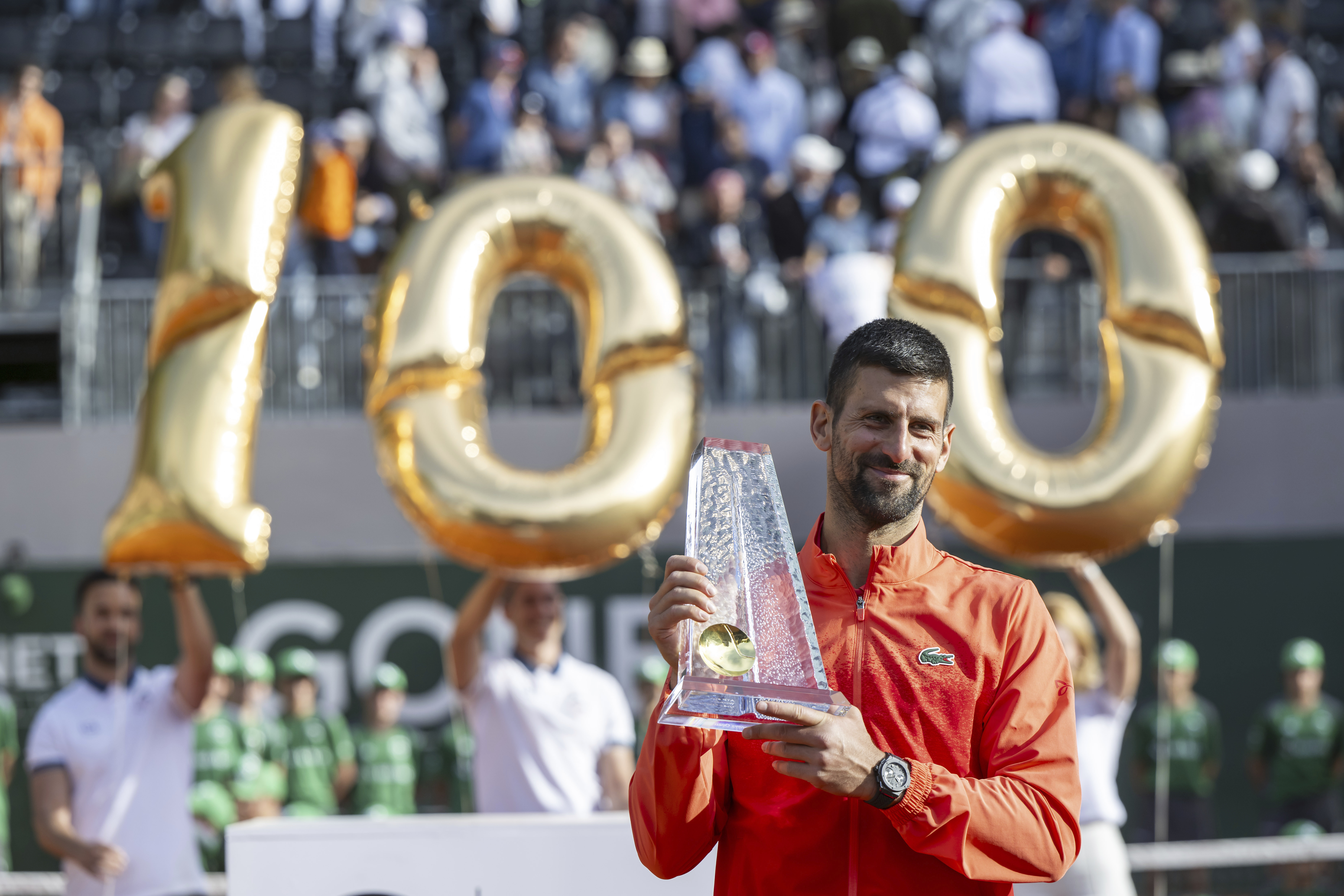 Winner Novak Djokovic of Serbia poses with the trophy after the final match of the ATP 250 Geneva Open tennis against Hubert Hurkacz of Poland, in Geneva, Switzerland, Saturday, May 24, 2025.
