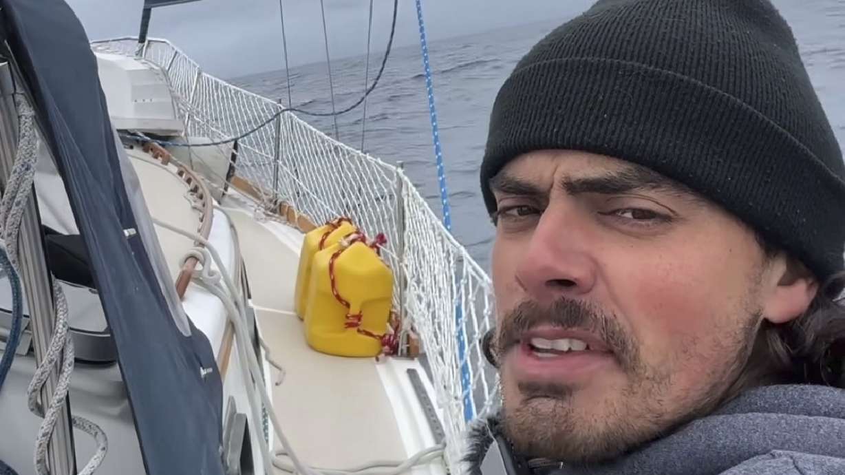 Oliver Widger talks to the camera somewhere in the Pacific Ocean as he and his cat, Phoenix, sail from Oregon to Hawaii on May 3.