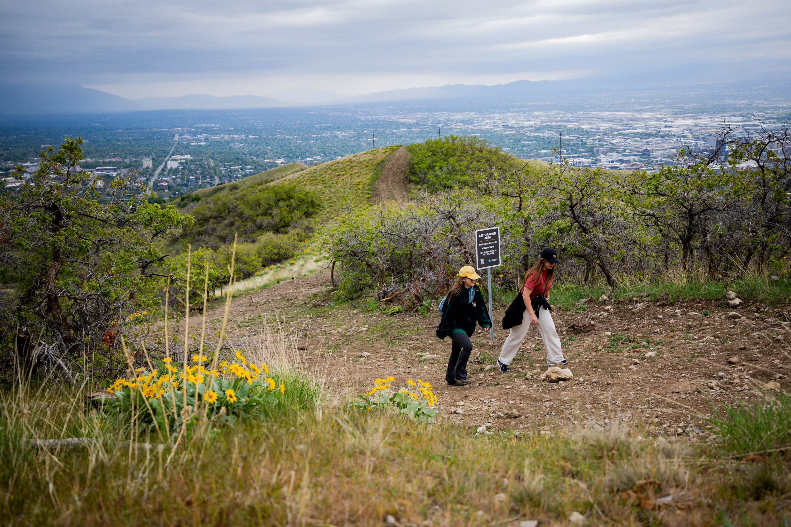 Lauren Johnson, from Salt Lake, left, and friend Brooklyn Eborn, from Kaysville, right, hike on the Bonneville Shoreline Trail in Salt Lake City on May 5