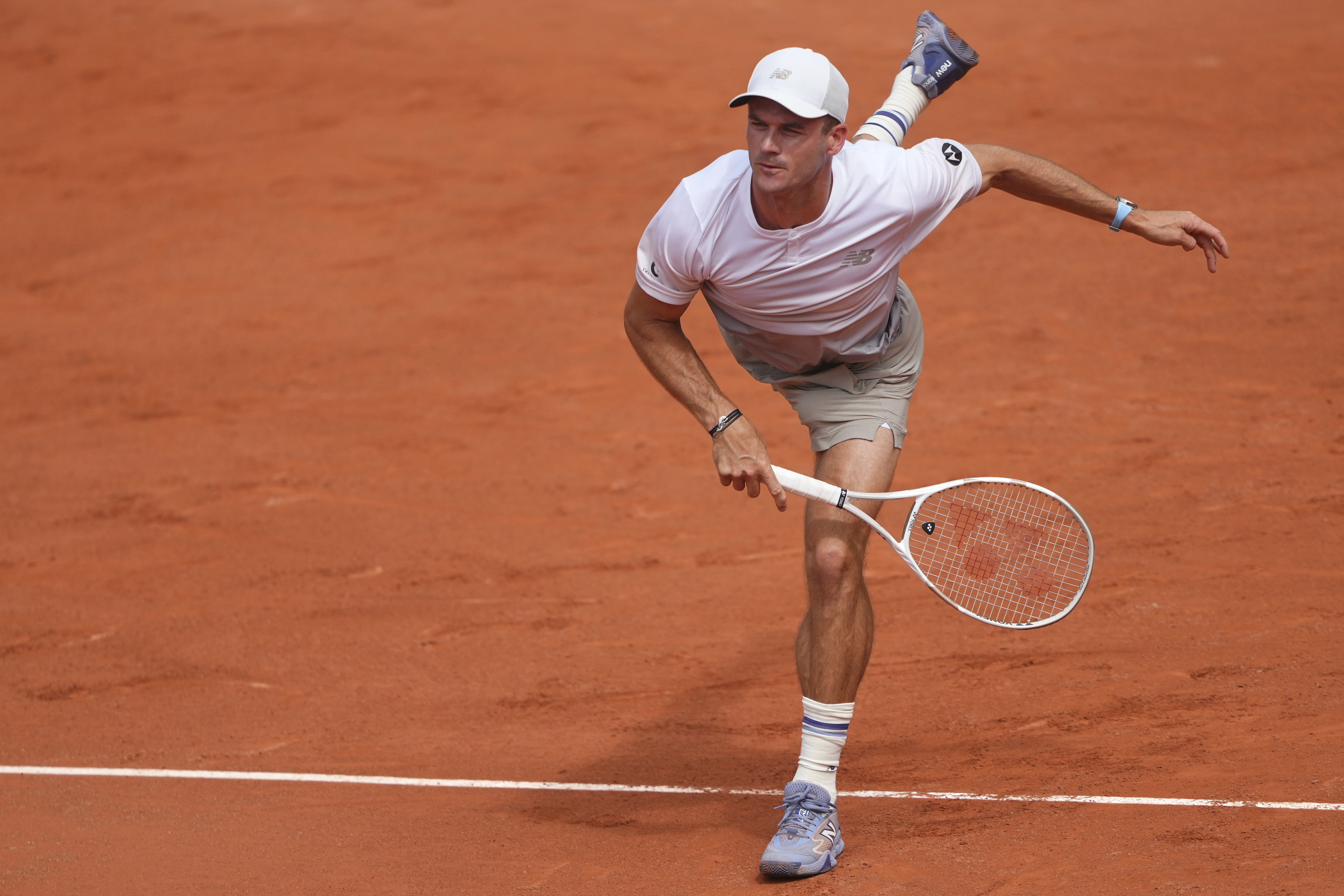 Tommy Paul of the U.S. serves against Denmark's Elmer Moller, during their first round match of the French Tennis Open at the Roland Garros stadium, in Paris, Sunday May 25, 2025. 