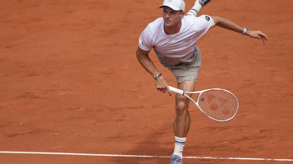 Tommy Paul of the U.S. serves against Denmark's Elmer Moller, during their first round match of the French Tennis Open at the Roland Garros stadium, in Paris, Sunday May 25, 2025.