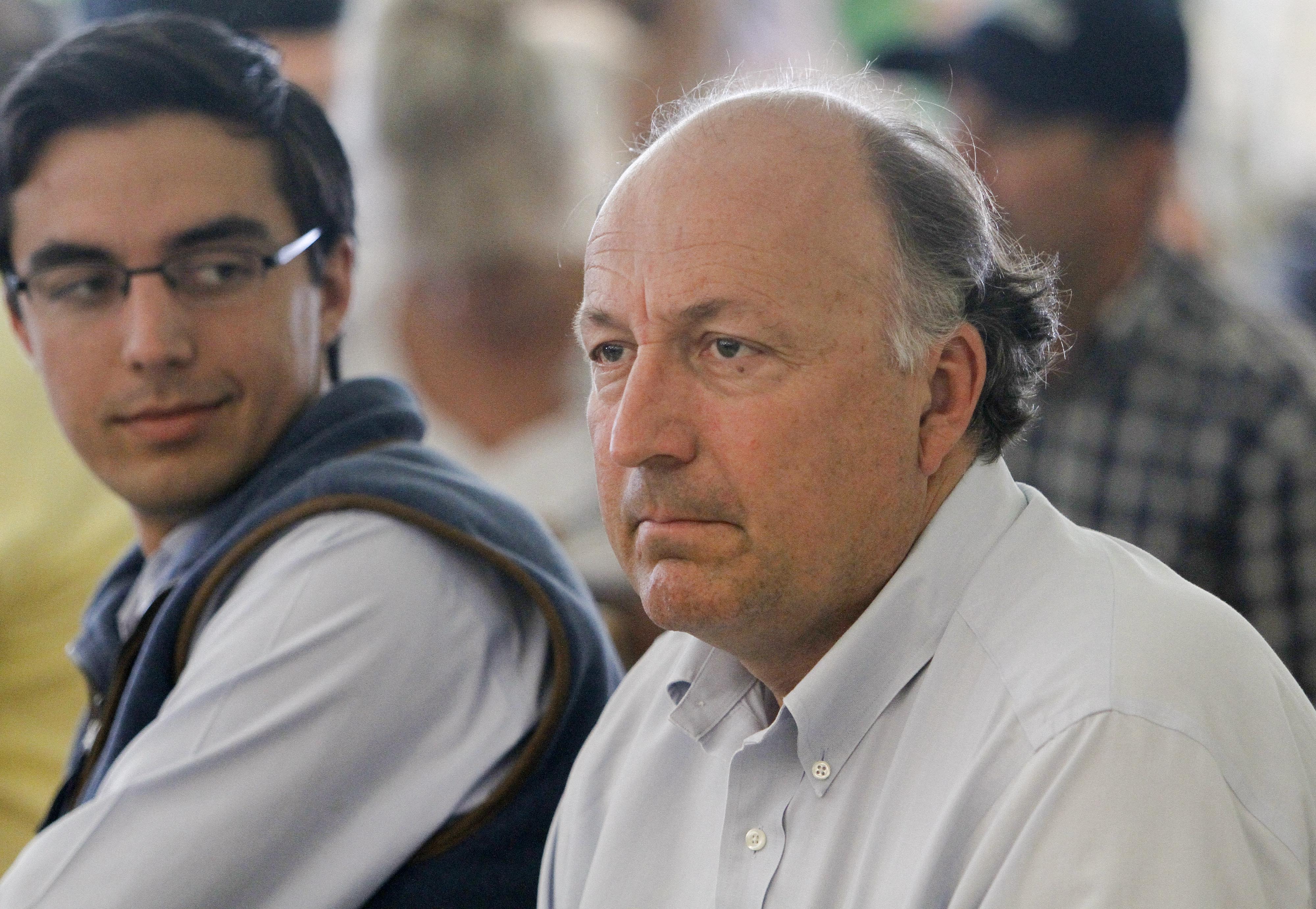 FILE - Tonalist trainer, Christophe Clement, right, listens during the draw for the Belmont Stakes horse race, Tuesday, June 3, 2014, at Belmont Park in Elmont, N.Y.