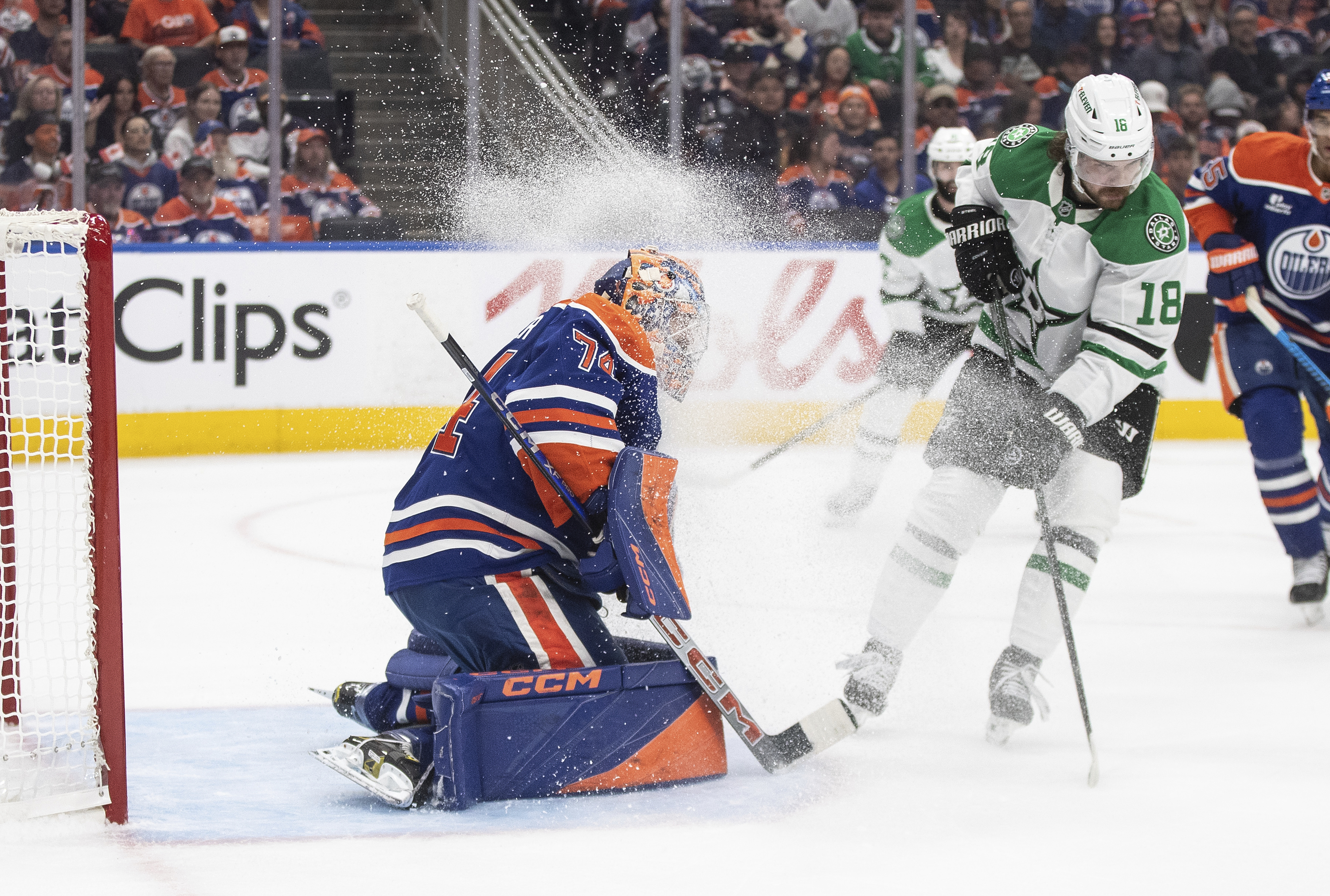 Dallas Stars' Sam Steel (18) sprays Edmonton Oilers goalie Stuart Skinner (74) with ice during the first period of Game 3 of the NHL hockey Stanley Cup Western Conference final in Edmonton, Alberta, Sunday, May 25, 2025. 