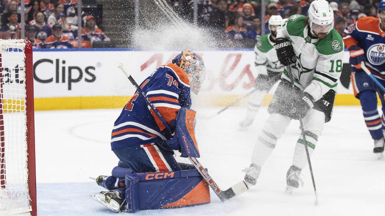Dallas Stars' Sam Steel (18) sprays Edmonton Oilers goalie Stuart Skinner (74) with ice during the first period of Game 3 of the NHL hockey Stanley Cup Western Conference final in Edmonton, Alberta, Sunday, May 25, 2025.