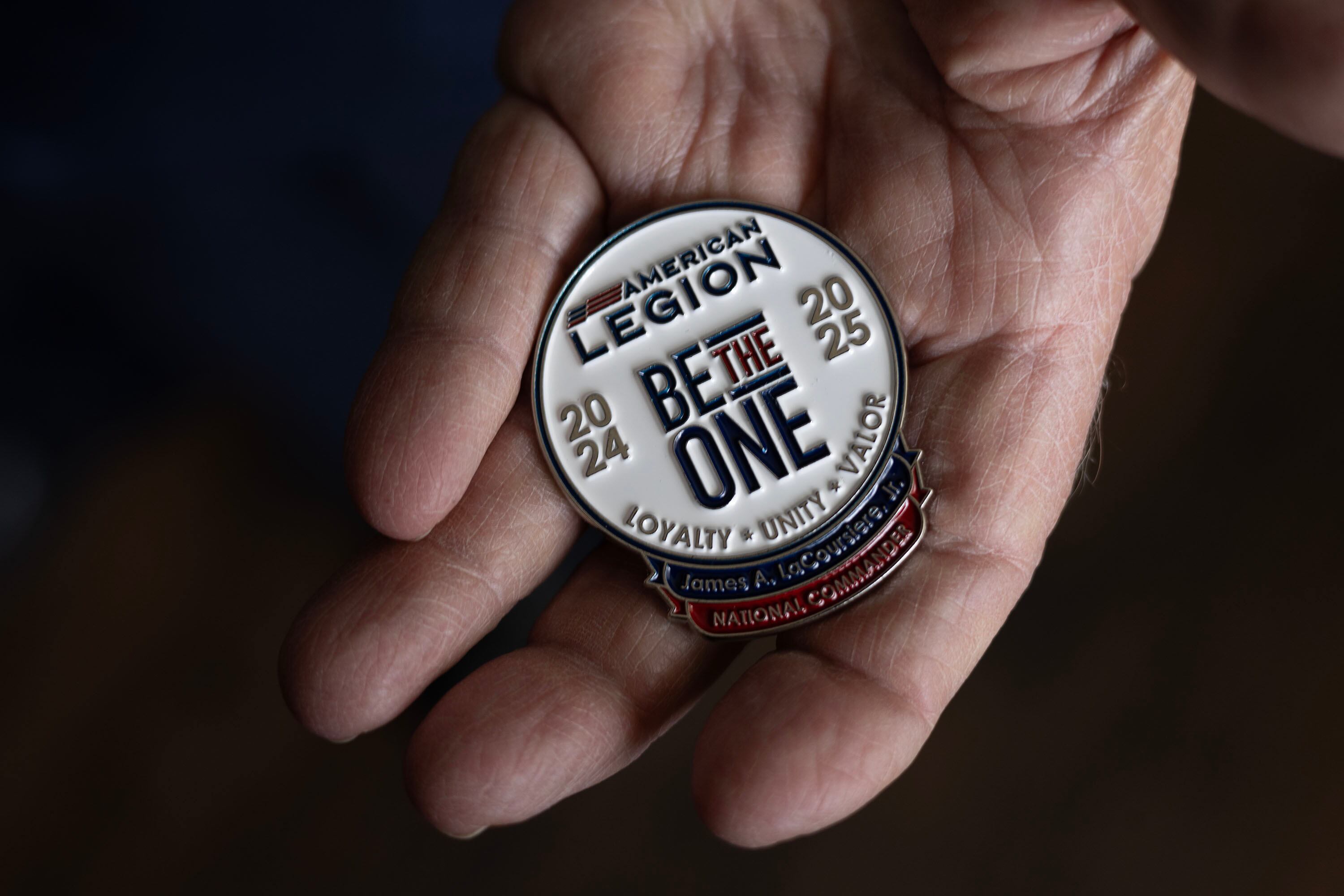 Terry Schow, retired executive director at the Utah Department of Veterans Affairs, displays a Be The One pin at the American Legion Post No. 9 in Ogden on May 15. The mission of the American Legion's Be The One initiative is to reduce the rate of veteran suicide.