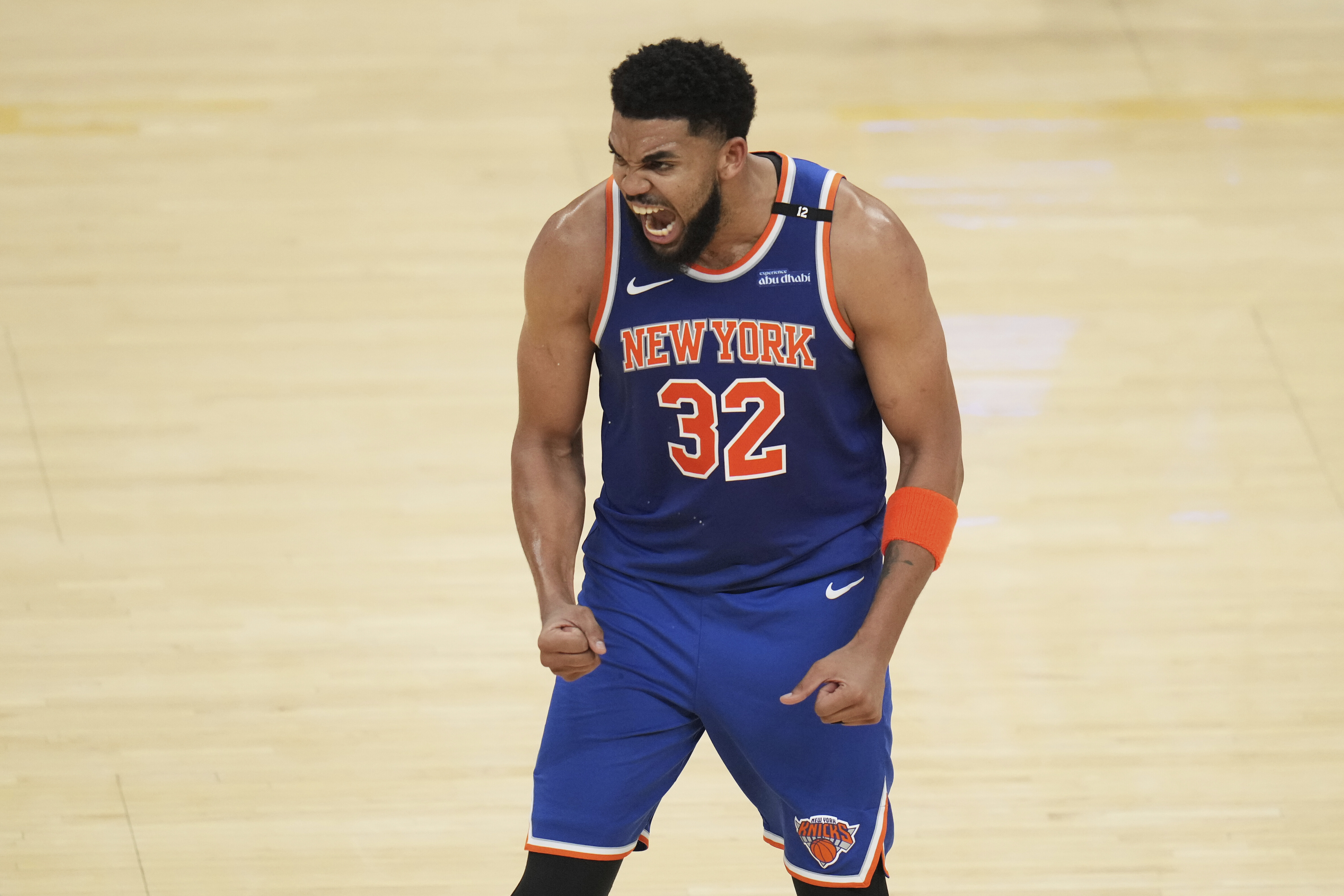 New York Knicks center Karl-Anthony Towns (32) reacts after scoring against the Indiana Pacers during the second half of Game 3 of the Eastern Conference finals of the NBA basketball playoffs Sunday, May 25, 2025, in Indianapolis. 