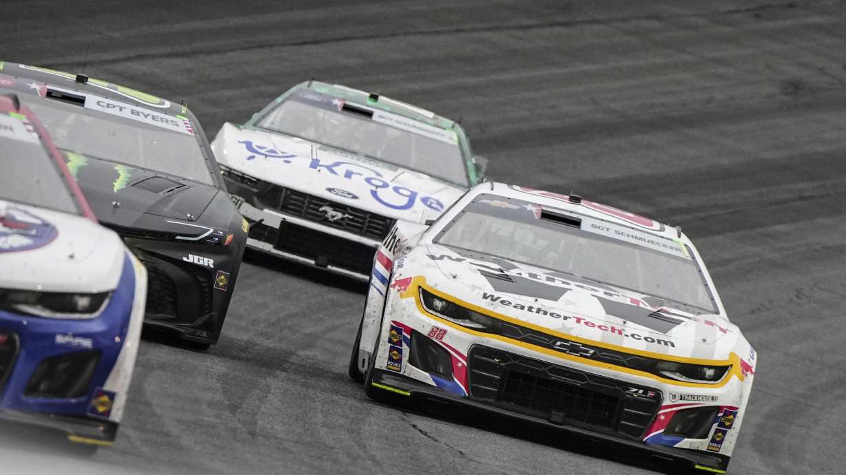 Shane van Gisbergen (88) passes Ty Gibbs in Turn 4 during a NASCAR Cup Series auto race at Charlotte Motor Speedway, Sunday, May 25, 2025, in Concord, N.C.