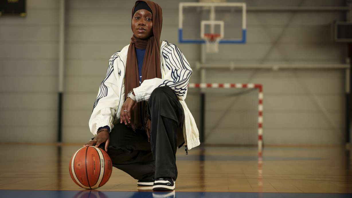 Former player Salimata Sylla poses before a women's basketball tournament where players can wear a headscarf, in Aubervilliers near Paris, Sunday, April 27, 2025.
