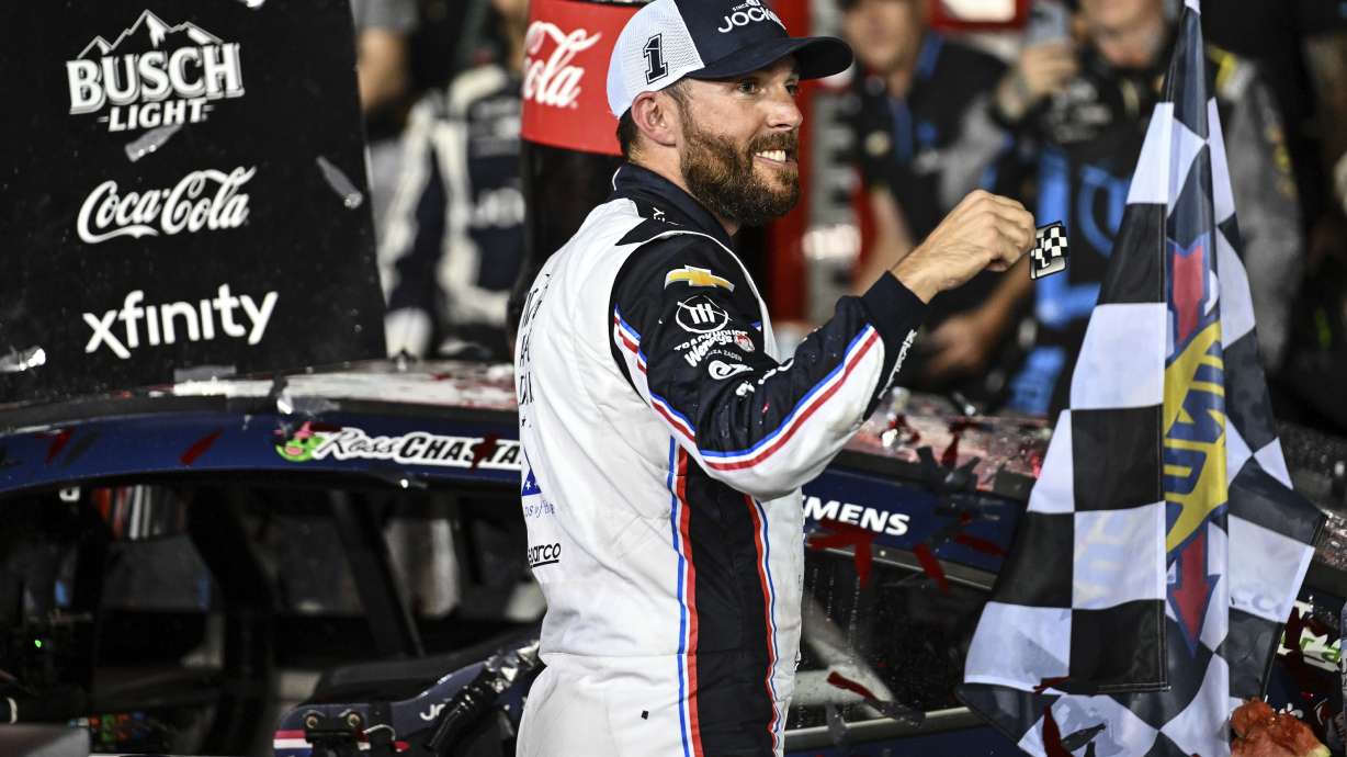 Ross Chastain celebrates in Victory Lane after winning a NASCAR Cup Series auto race at Charlotte Motor Speedway, Sunday, May 25, 2025, in Concord, N.C.