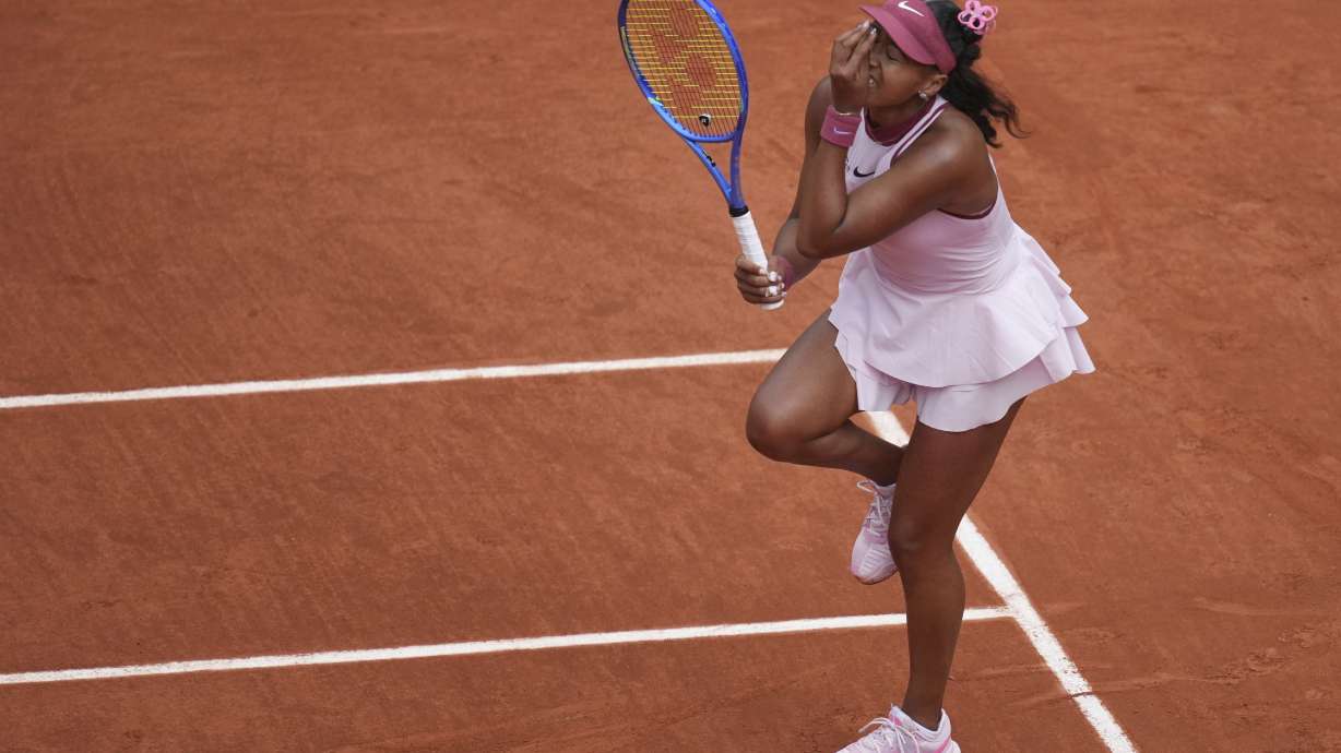 Japan's Naomi Osaka reacts as she plays Spain's Paula Badosa during their first round match of the French Tennis Open, at the Roland-Garros stadium, in Paris, Monday, May 26, 2025.