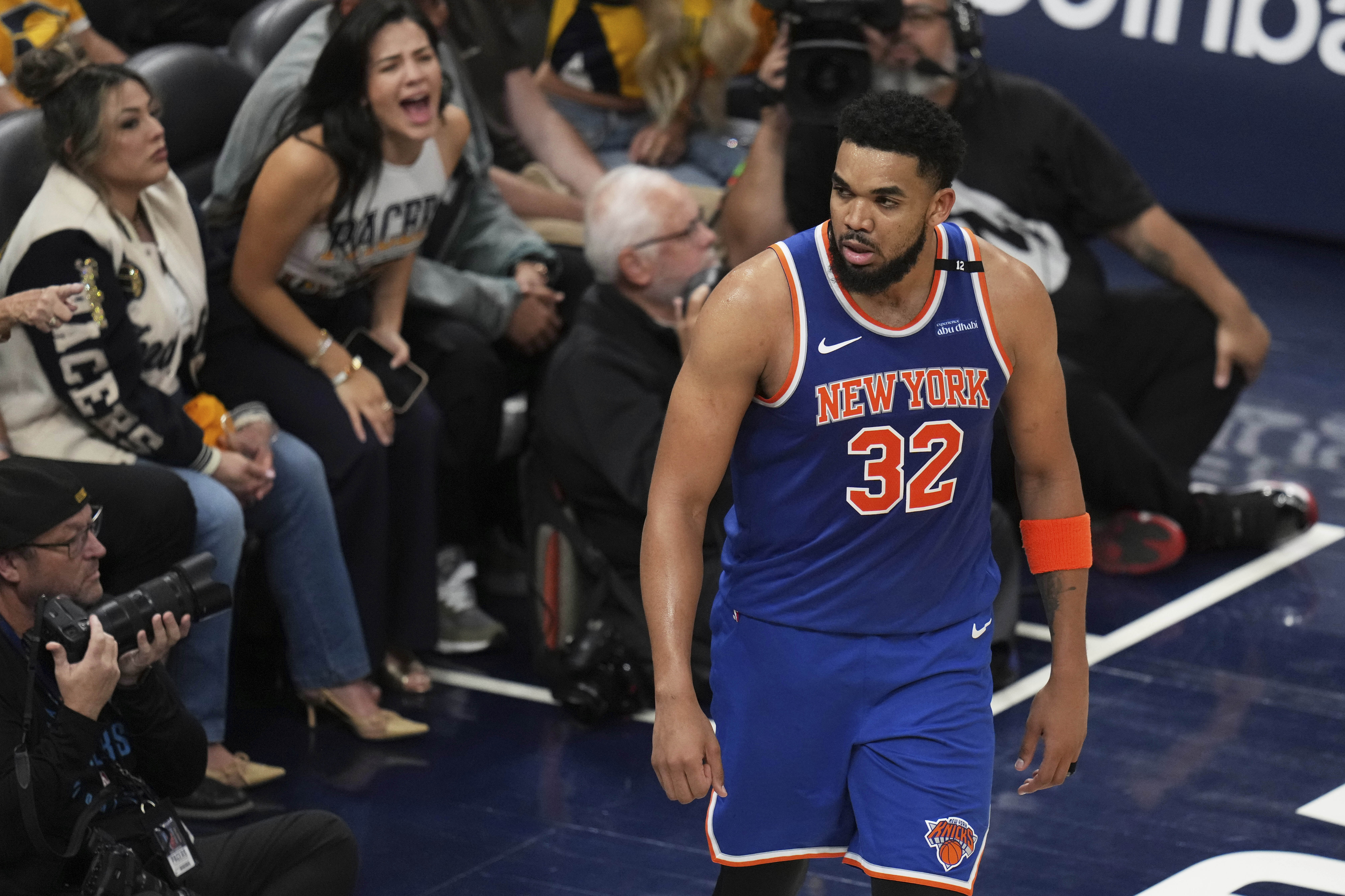 New York Knicks center Karl-Anthony Towns (32) reacts after scoring against the Indiana Pacers during the second half of Game 3 of the Eastern Conference finals of the NBA basketball playoffs Sunday, May 25, 2025, in Indianapolis.