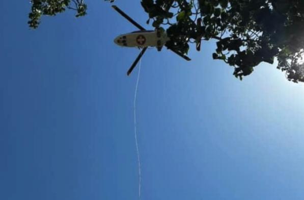 A medical helicopter hoists a 64-year-old man after he fell 20 feet in Adams Canyon in Layton on Monday.
