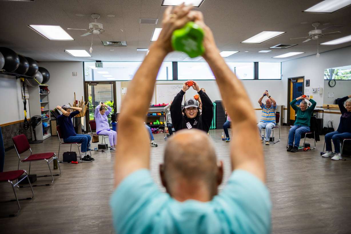 University of Utah kinesiology senior student Brayden Kellogg, center, instructs an overall fitness class targeted toward senior adults for his capstone class at the Murray City Senior Recreation Center on Tuesday.