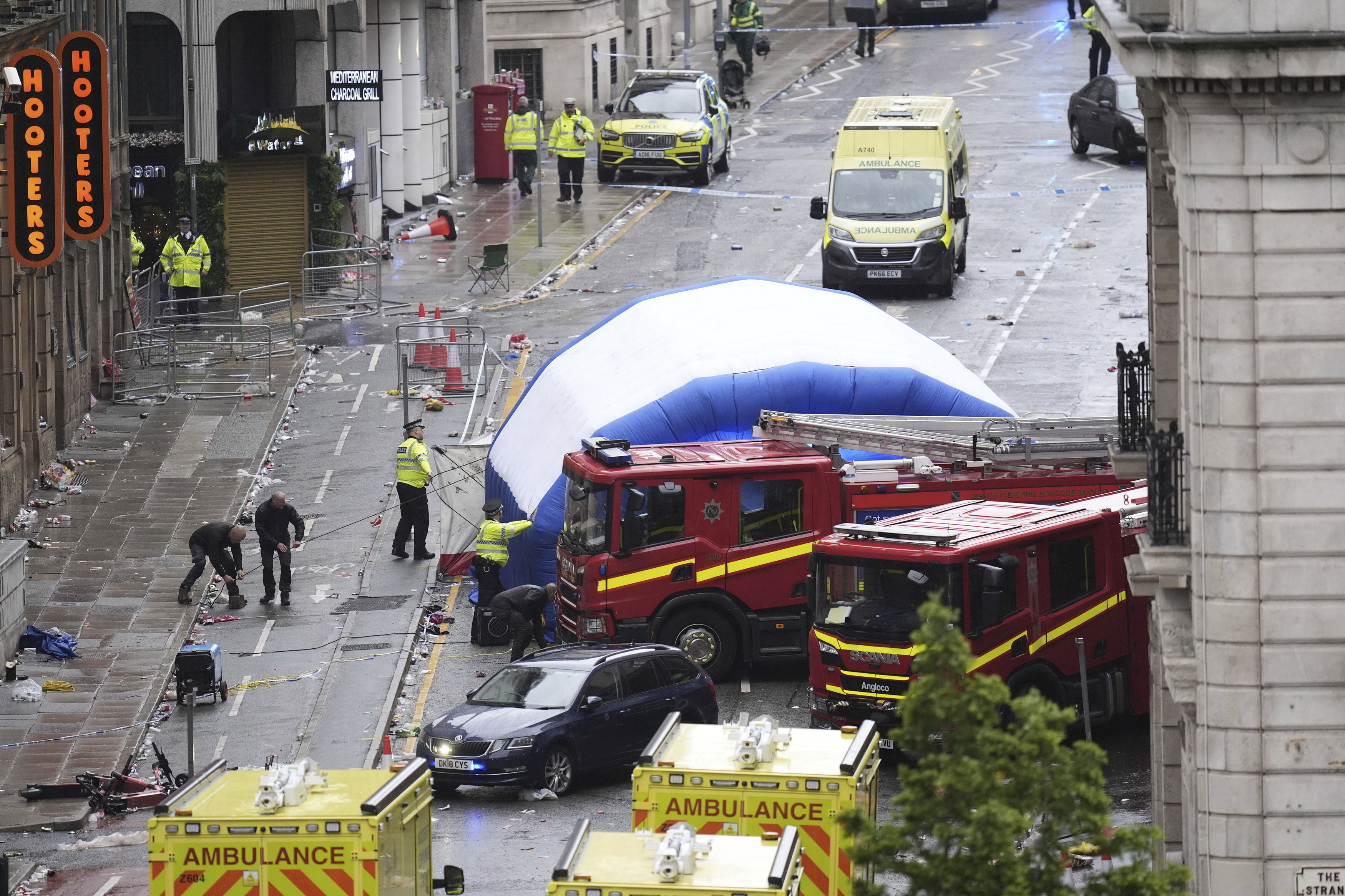 A tent is erected by police at the site of an incident on Water Street near the Liver Building in Liverpool after a car collided with pedestrians during the Premier League winners parade, in Liverpool, England, Monday May 26, 2025. 
