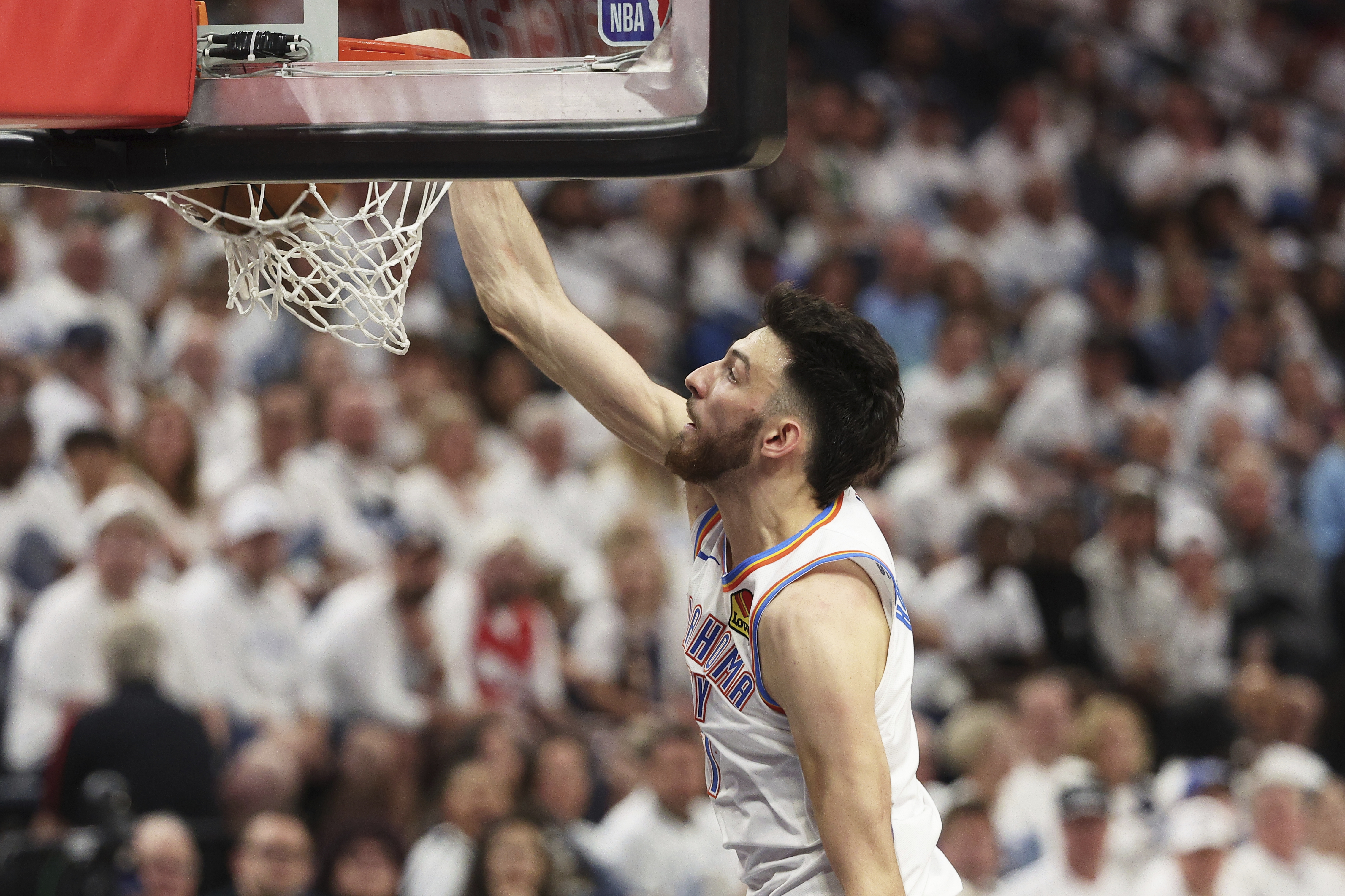 Oklahoma City Thunder forward Chet Holmgren dunks against the Minnesota Timberwolves during the second half of Game 4 of the Western Conference finals of the NBA basketball playoffs Monday, May 26, 2025, in Minneapolis.