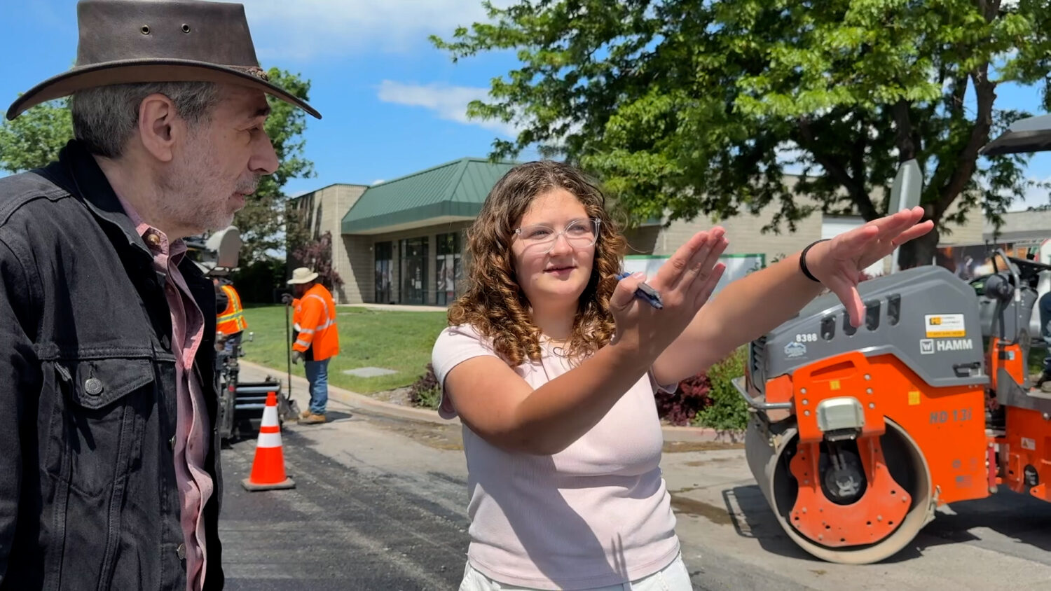 Orem High student Julianna Snow talks with Director Alan Weiss on the set of their PSA about driving safety in Orem on Monday.