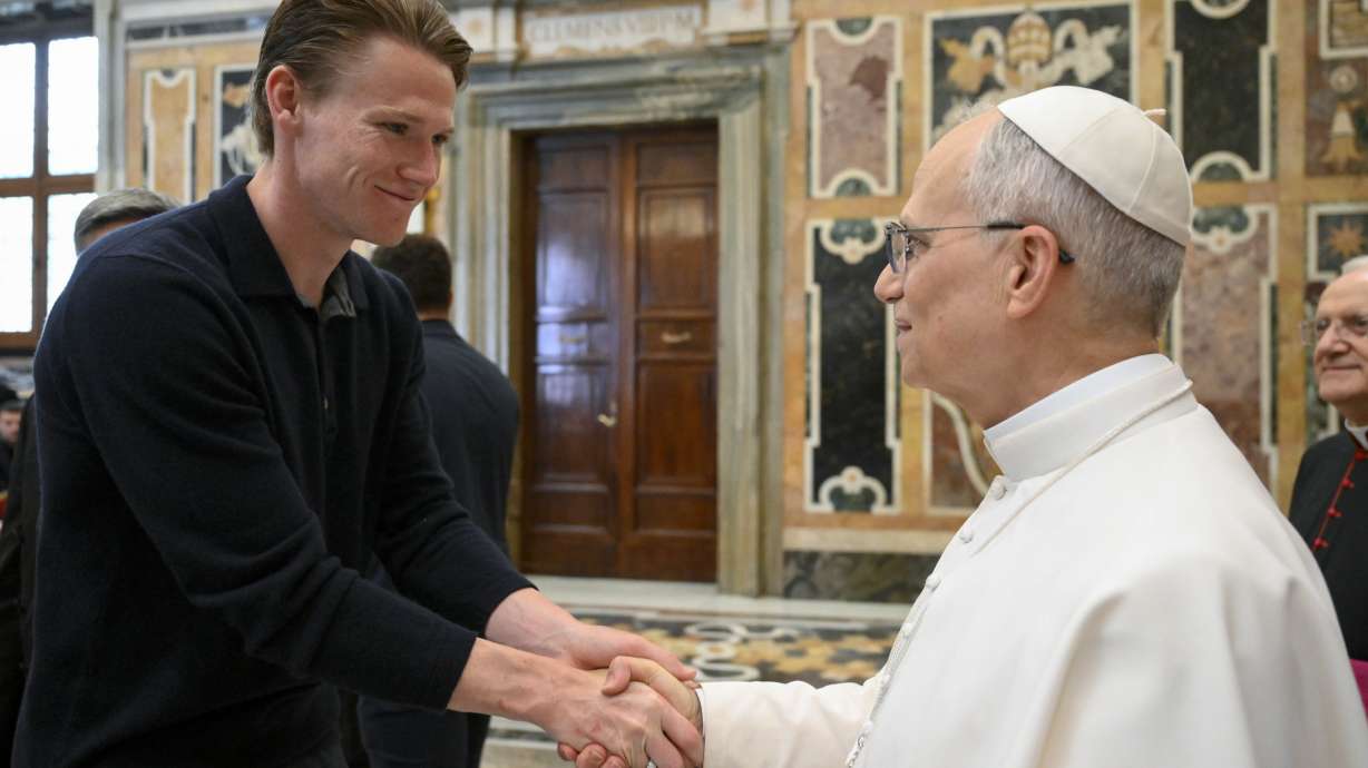 Napoli soccer team's midfielder Scott McTominay, left, shakes hands with Pope Leo XIV during a papal private audience with the team in the Clementine Hall at the Vatican, Tuesday, May 27, 2025.