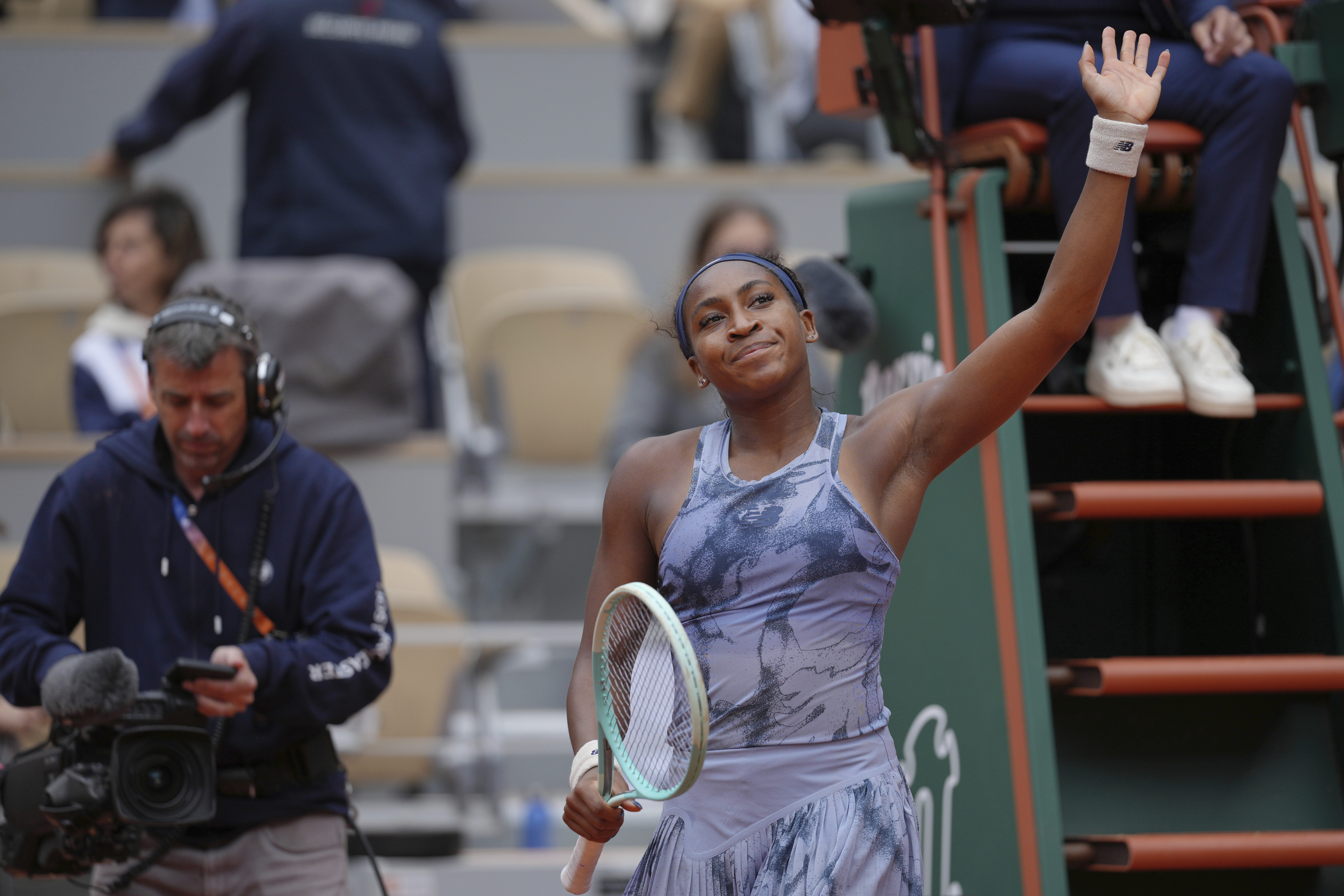 Coco Gauff of the U.S. waves to fans after defeating Australia's Olivia Gadecki during their first round match of the French Tennis Open, at the Roland-Garros stadium, in Paris, Tuesday, May 27, 2025. 