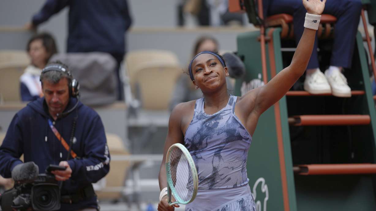 Coco Gauff of the U.S. waves to fans after defeating Australia's Olivia Gadecki during their first round match of the French Tennis Open, at the Roland-Garros stadium, in Paris, Tuesday, May 27, 2025.