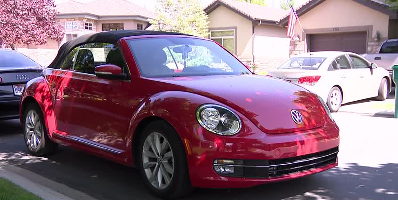 Orem High School student Julianna Snow's bright red Volkswagen Beetle named Fanny, shown here in Orem Monday, is featured in her PSA about driving safety.