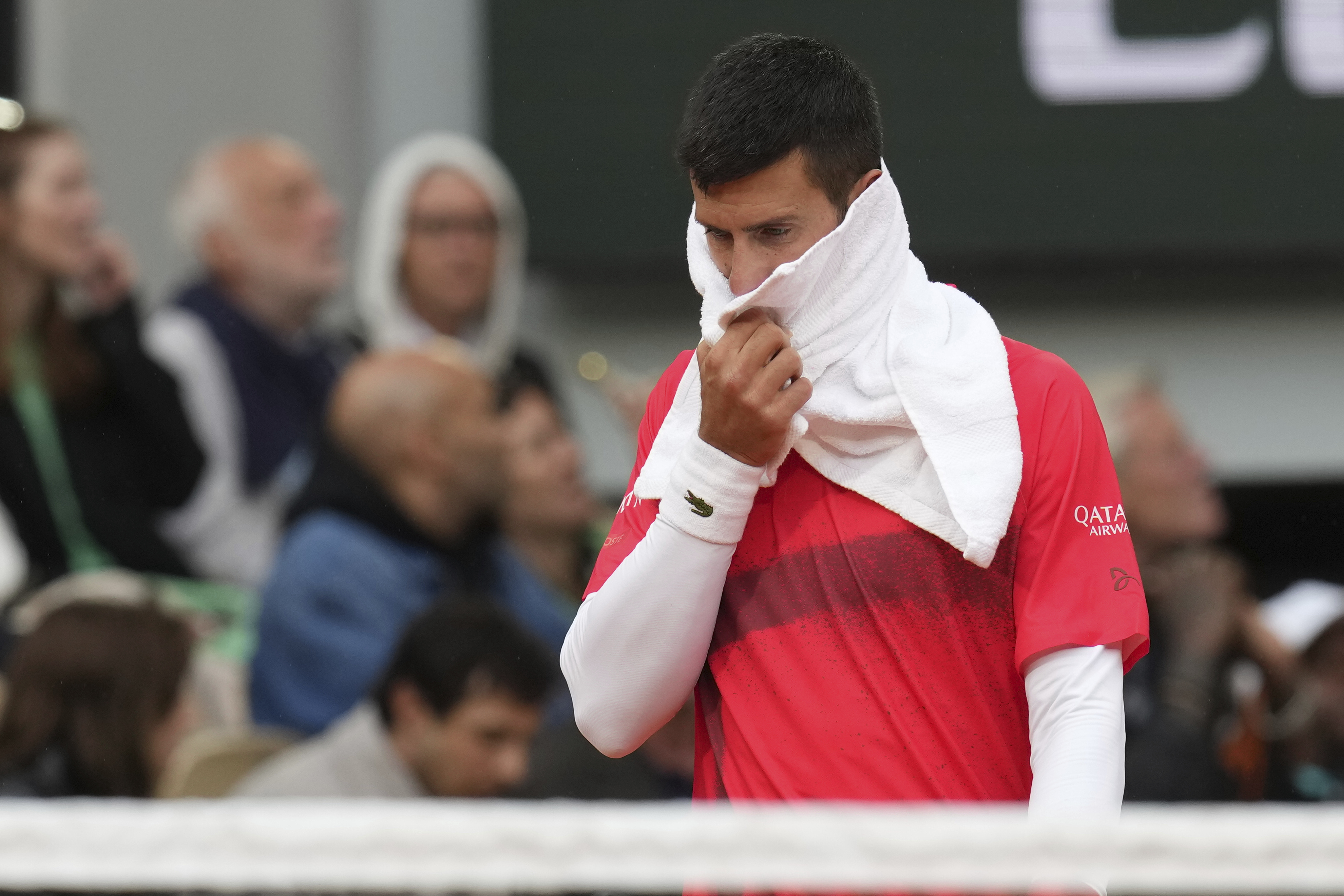 Serbia's Novak Djokovic reacts as he plays Mackenzie McDonald of the U.S. during their first round match of the French Tennis Open, at the Roland-Garros stadium, in Paris, Tuesday, May 27, 2025. 