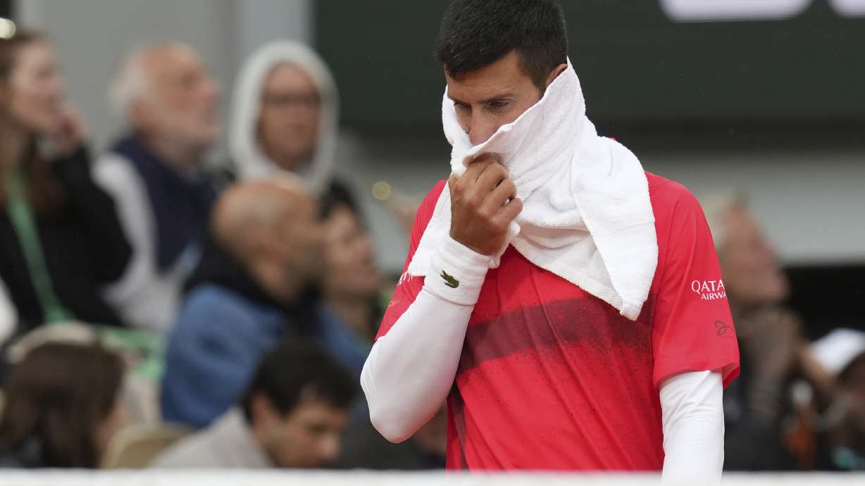 Serbia's Novak Djokovic reacts as he plays Mackenzie McDonald of the U.S. during their first round match of the French Tennis Open, at the Roland-Garros stadium, in Paris, Tuesday, May 27, 2025.