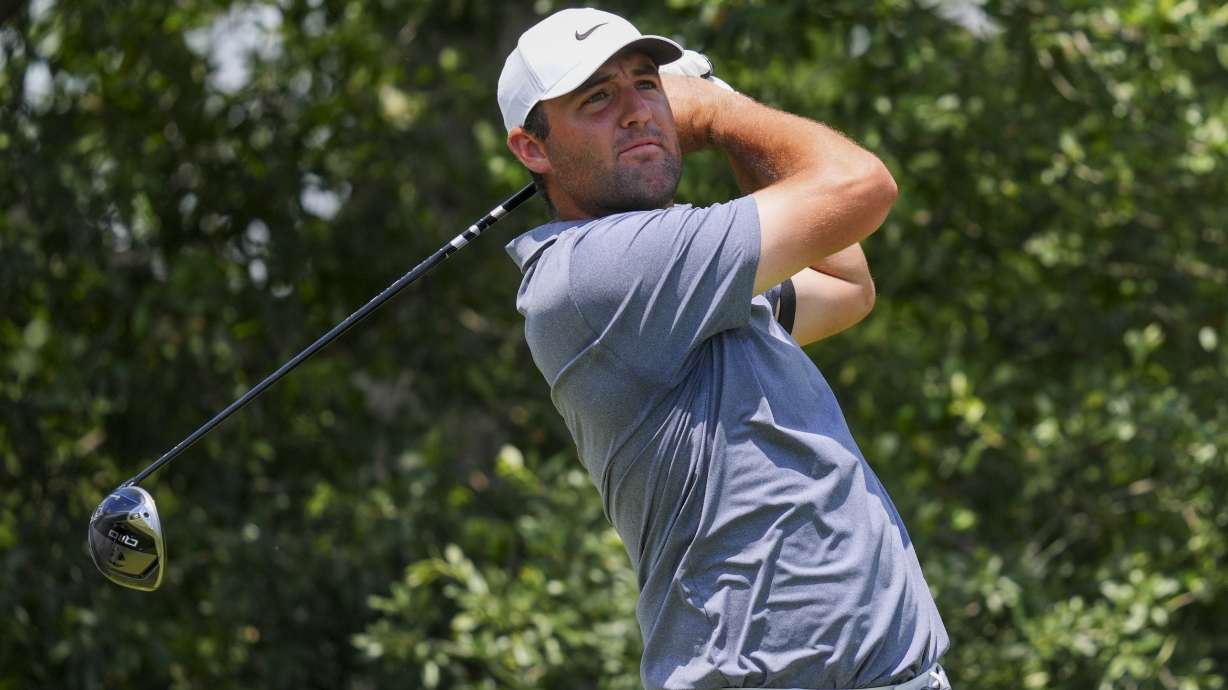 Scottie Scheffler watches his tee shot on the ninth hole during the final round of the Charles Schwab Challenge golf tournament at Colonial Country Club in Fort Worth, Texas, Sunday, May 25, 2025.