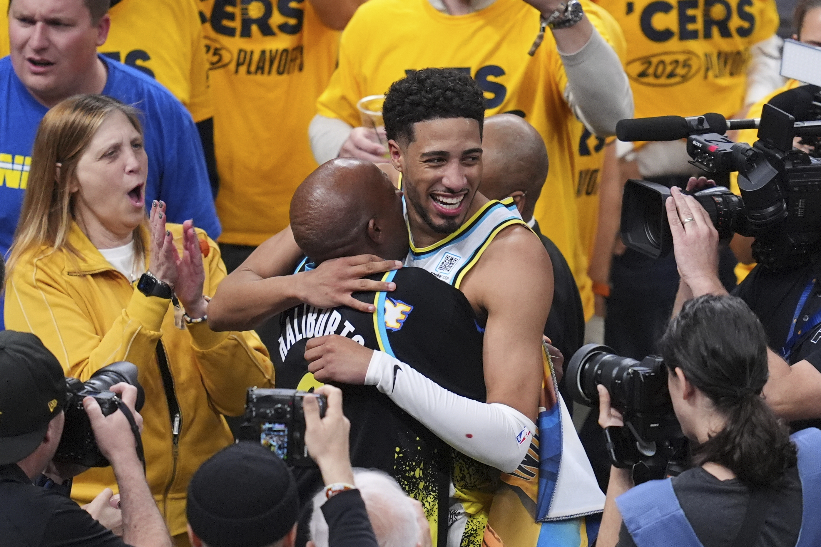 Indiana Pacers guard Tyrese Haliburton (0) hugs his father John Haliburton following Game 5 of an NBA basketball first-round playoff series against the Milwaukee Bucks, Tuesday, April 29, 2025, in Indianapolis. 
