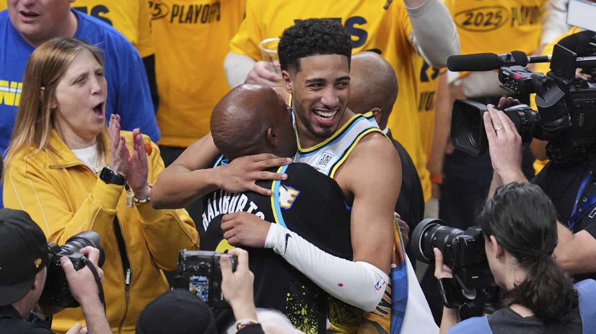 Indiana Pacers guard Tyrese Haliburton (0) hugs his father John Haliburton following Game 5 of an NBA basketball first-round playoff series against the Milwaukee Bucks, Tuesday, April 29, 2025, in Indianapolis.