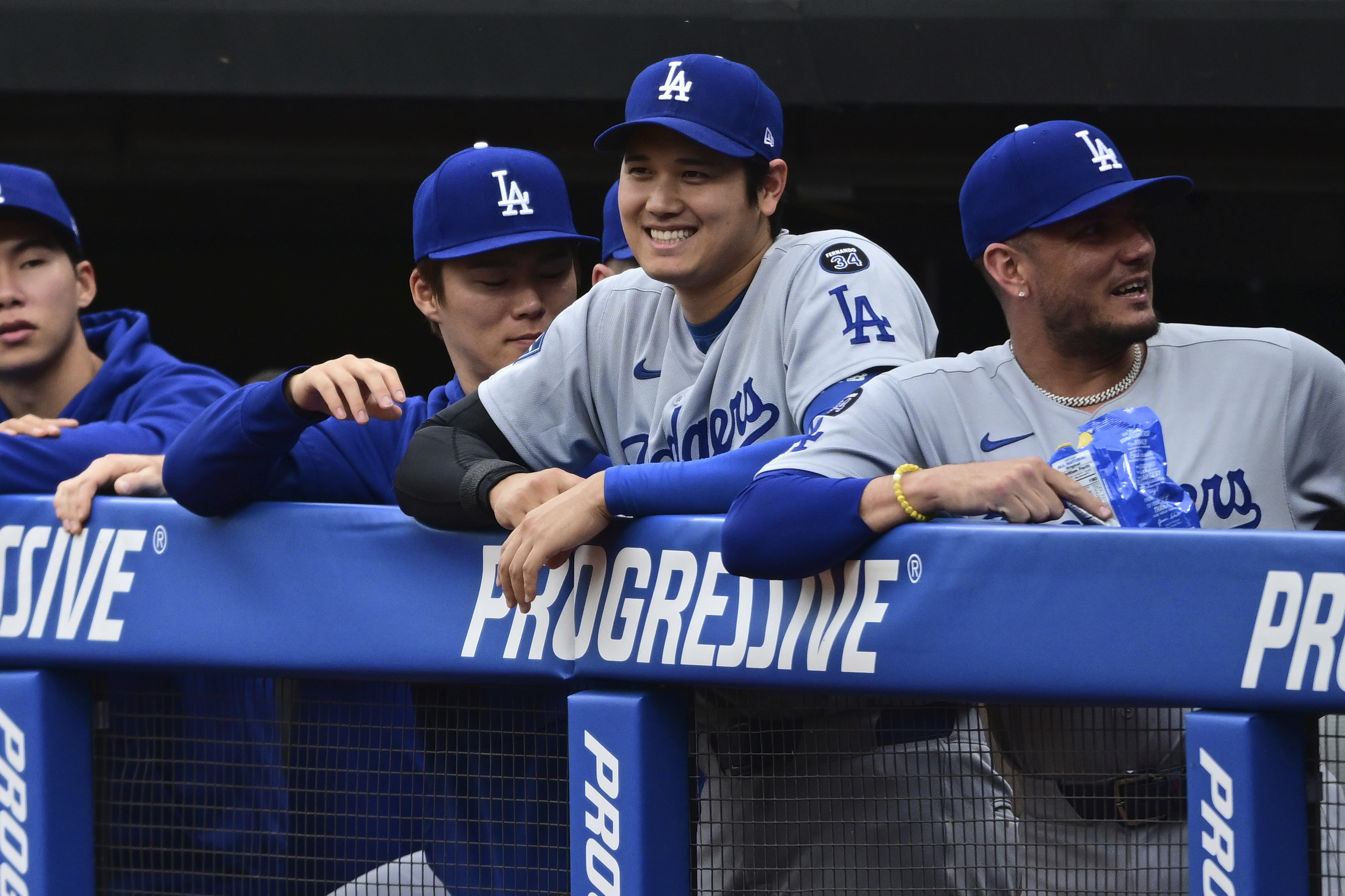 Los Angeles Dodgers' Shohei Ohtani smiles in the dugout during the first inning of a baseball game against the Cleveland Guardians, Tuesday, May 27, 2025, in Cleveland. 