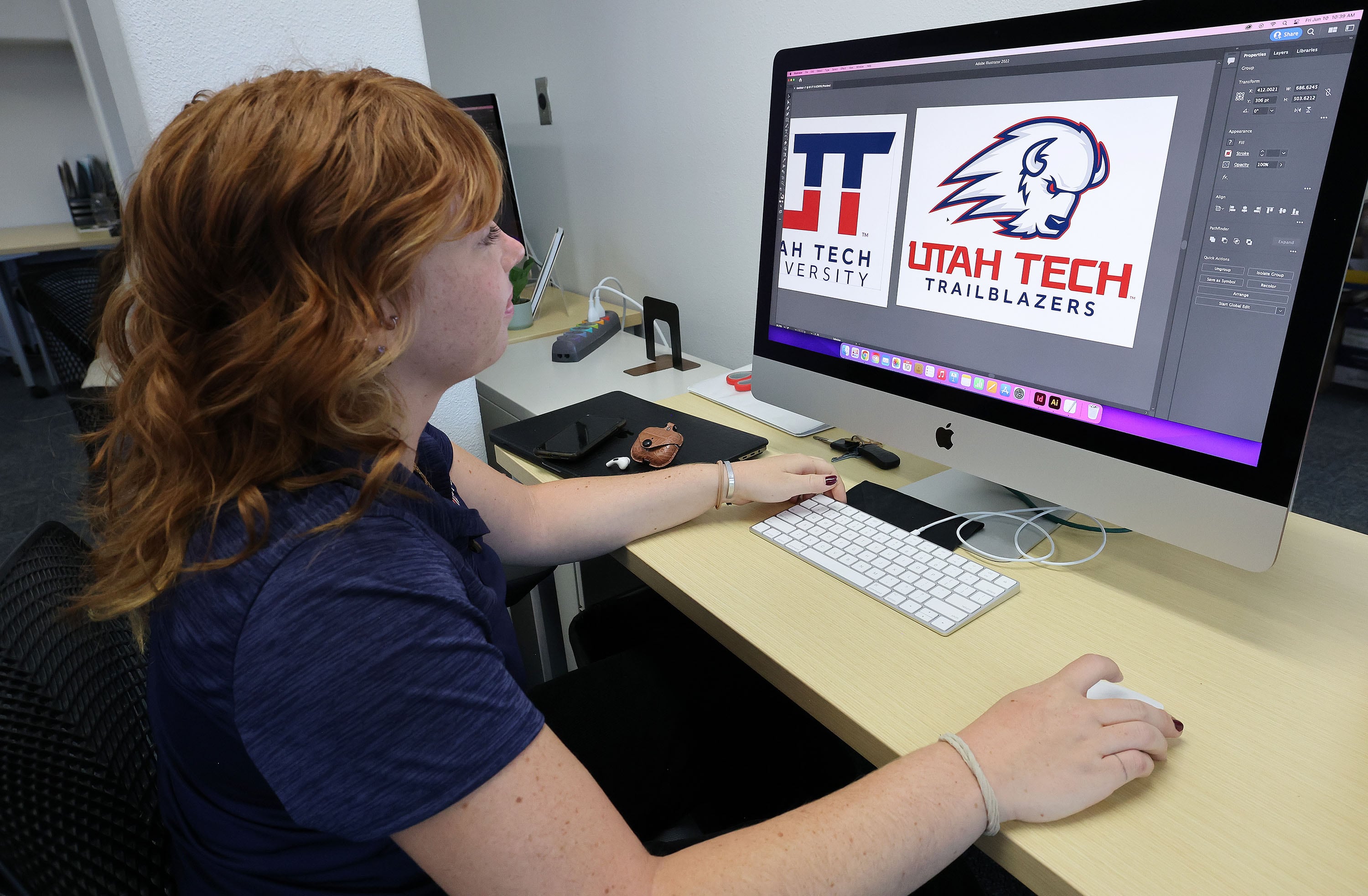 Brooke Tyler works on a Utah Tech University design at Dixie State University in St. George, June 10, 2022. The university officially became known as Utah Tech University on July 1, 2022.