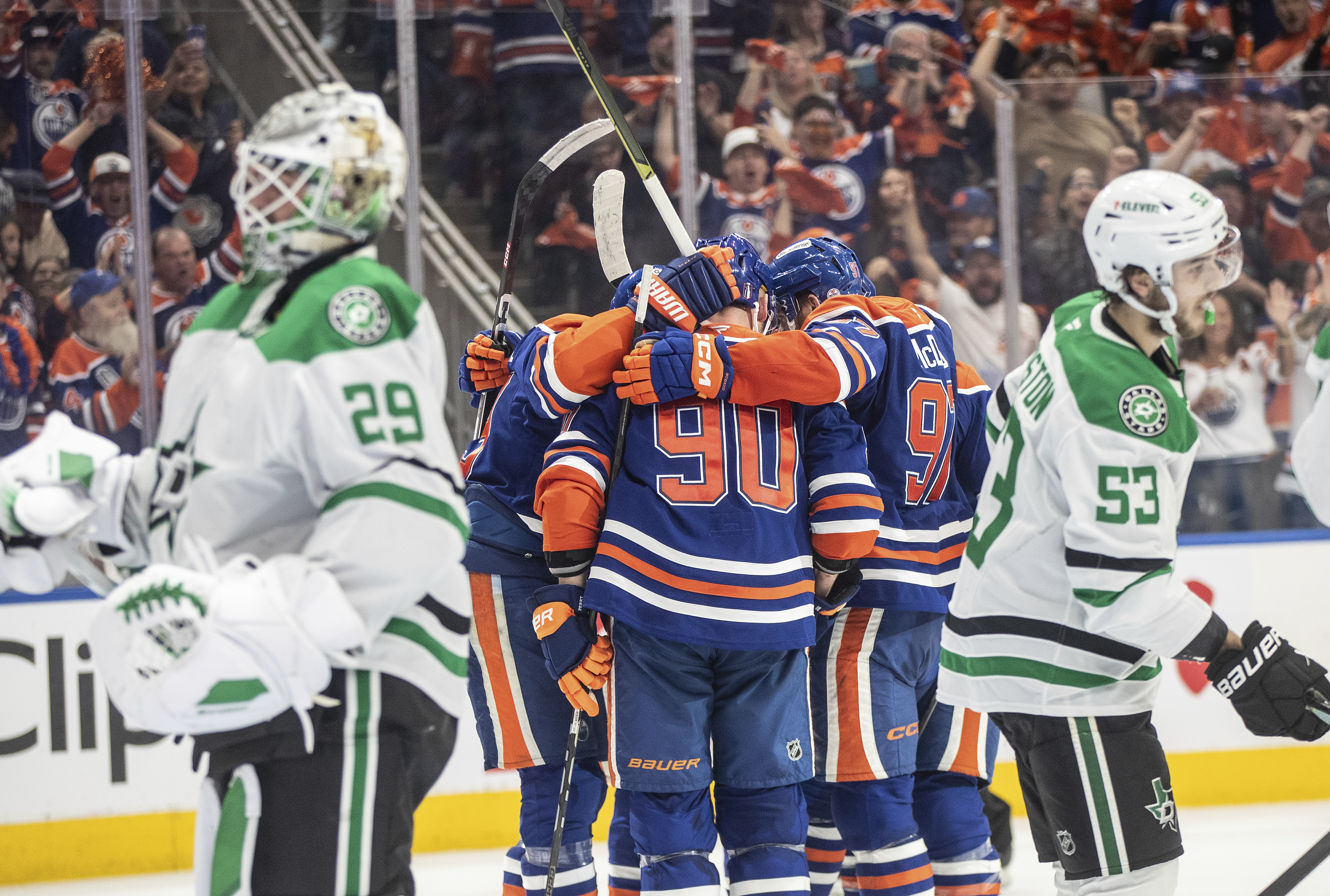 Edmonton Oilers players celebrate a goal as Dallas Stars goalie Jake Oettinger (29) and Wyatt Johnston (53) look on during second period NHL Western Conference final playoff action, in Edmonton on Tuesday, May 27, 2025. 