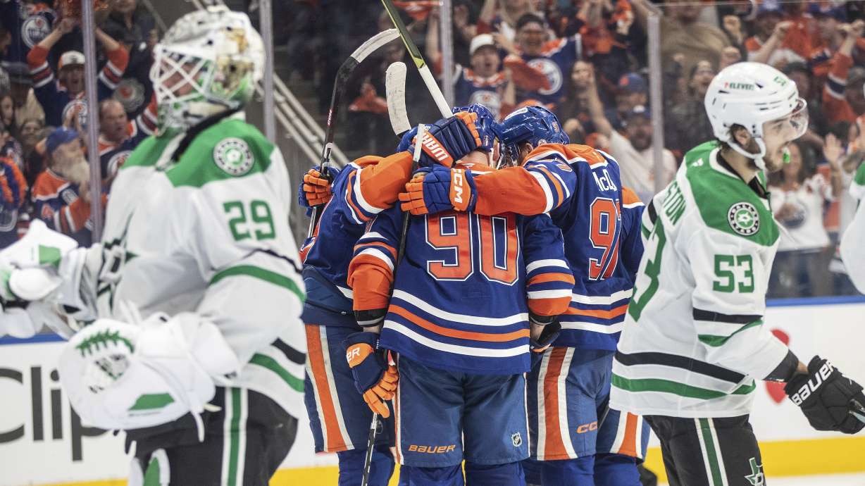Edmonton Oilers players celebrate a goal as Dallas Stars goalie Jake Oettinger (29) and Wyatt Johnston (53) look on during second period NHL Western Conference final playoff action, in Edmonton on Tuesday, May 27, 2025.